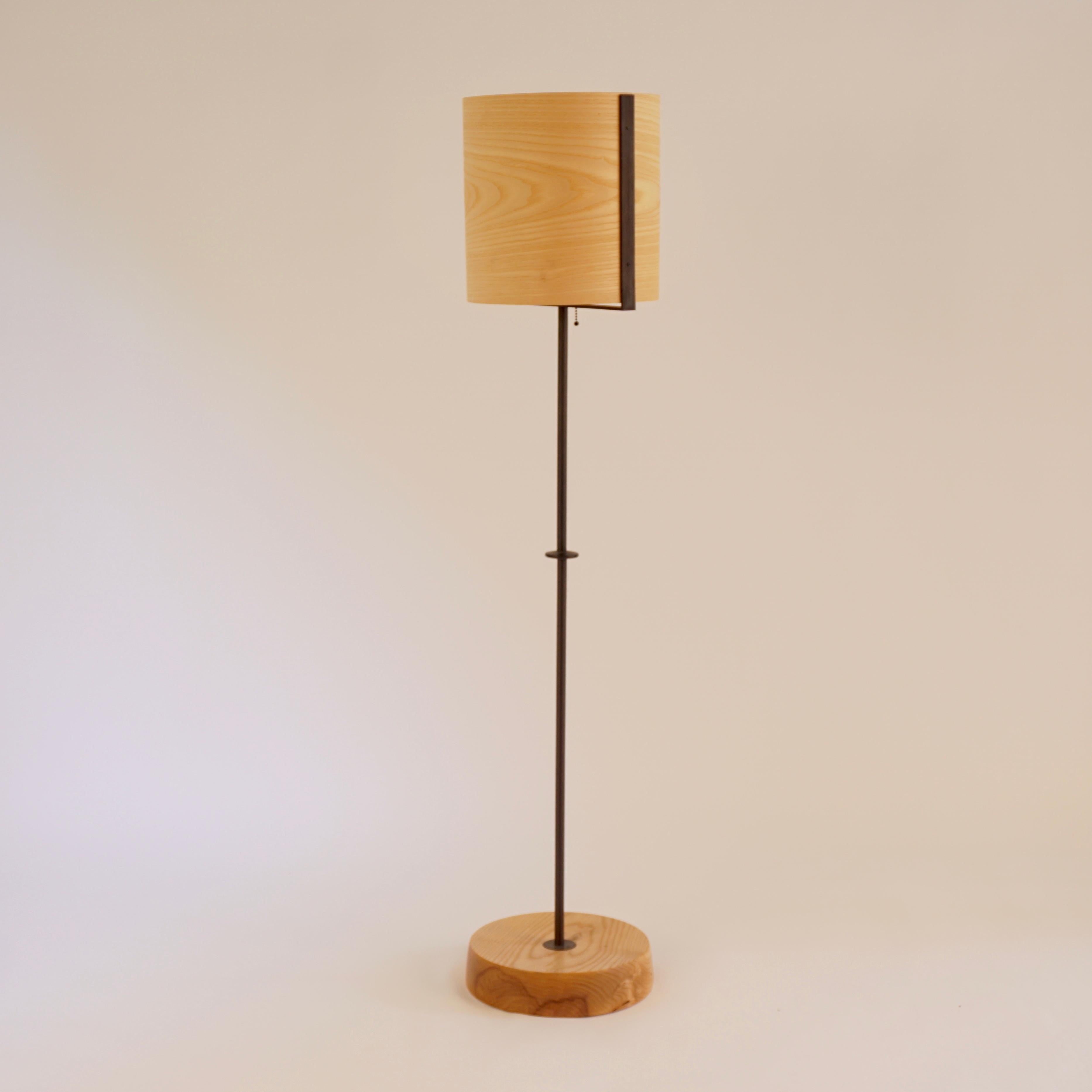 The ash veneer floor lamp #8 is part of the original Lehrecke Veneer Lighting Collection from 1998. The idea began with the beautiful way light passed through thin wood veneers, mostly local woods. The ash has a lightly yellow glow when lit and the