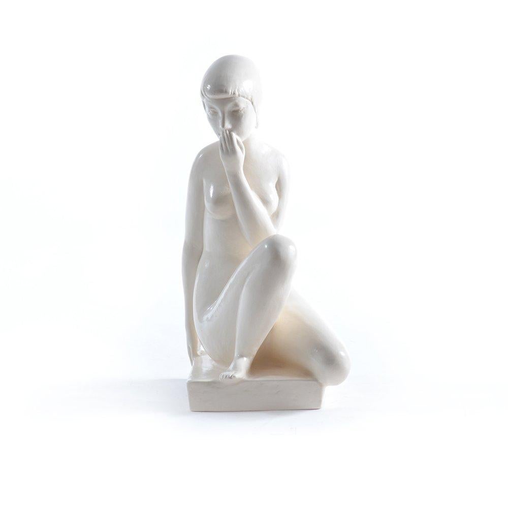 An impressive sculpture in cream/white color and deep emotional feeling. The sculpture portraits a shy, young girl. Made of glazed gypsum, it is in a very good, original condition without any wear or damages. The sculpture has a lot of beautiful