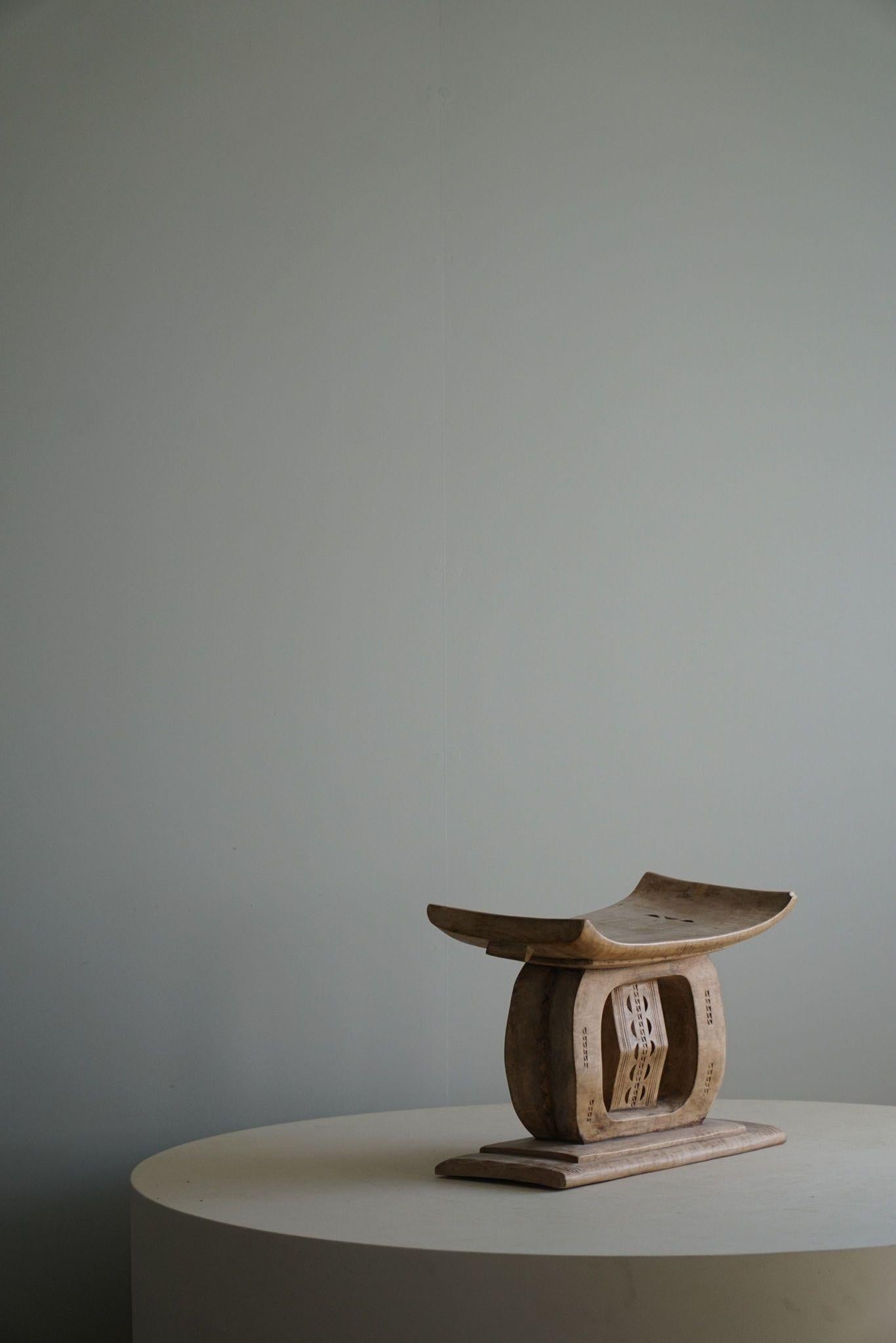 A highly decorative handcrafted Ashanti stool, made in West Africa(Ghana) in the 1970s. A unique design making it a one-of-a-kind piece for your home.

A beautiful wabi sabi object with a fine patina. Perfect as functional side table or decorative