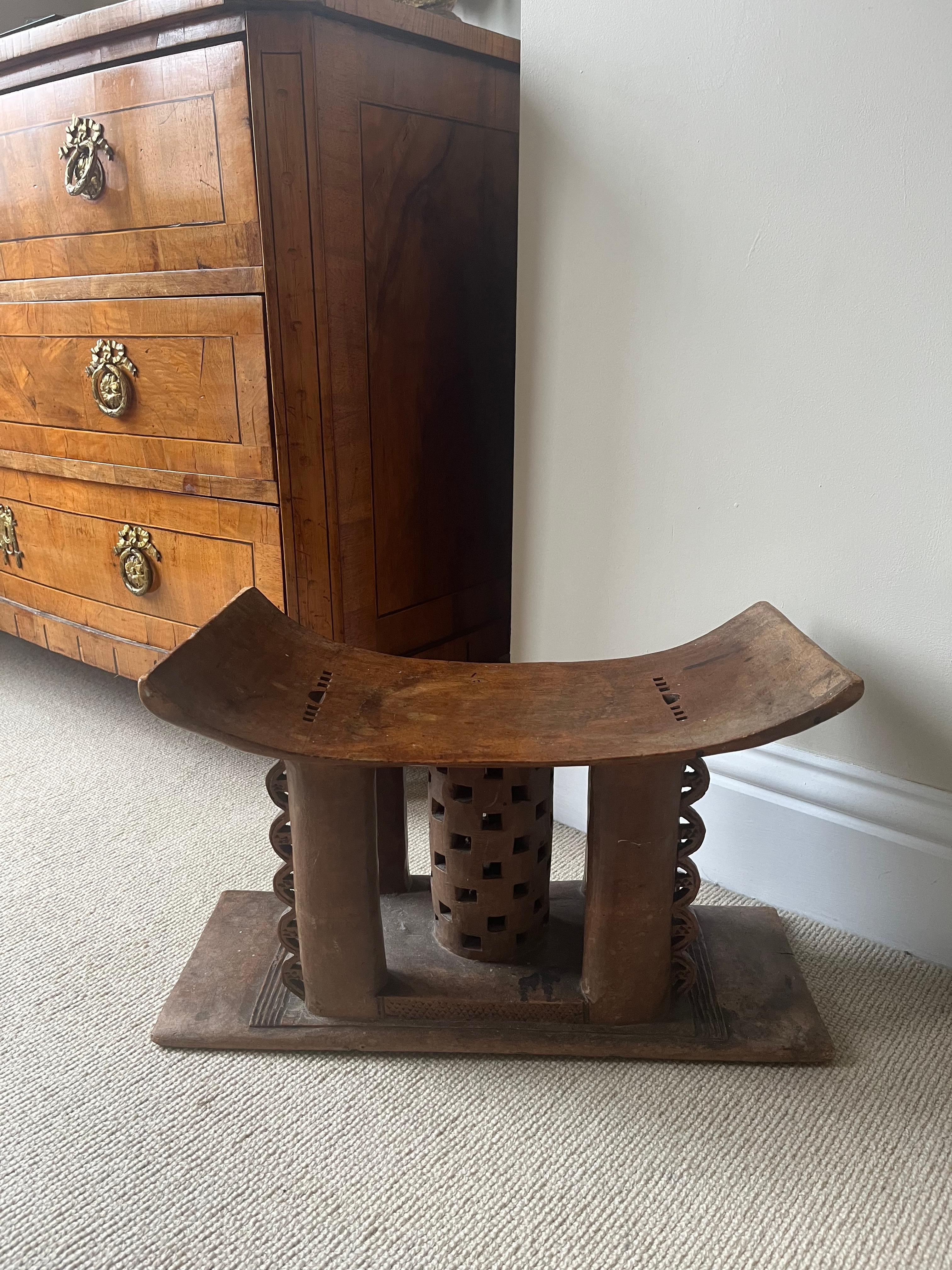An early to mid 20th century Ashanti tribal stool. An original piece which has been well used and not produced for the tourist industry. Carved from a single piece of wood.