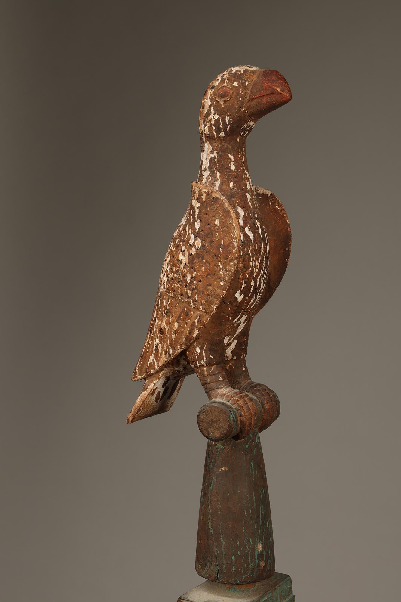 Carved painted wood Ashanti Linguist Staff with bird top and twisted knots forms.  A staff like this was the symbol of office for the linguist, a trained orator who spoke on behalf of the Asante ruler of Ghana.
Staff was carved from separate pieces