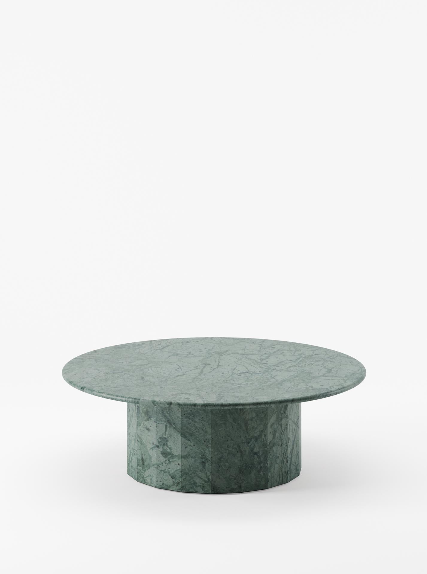The Ashby round coffee table stands as a testament to Lemon's commitment to embracing simplicity. Inspired by the beauty of marble, its slim round top harmonizes elegantly with a sturdy faceted base—a deliberate and defining design element.