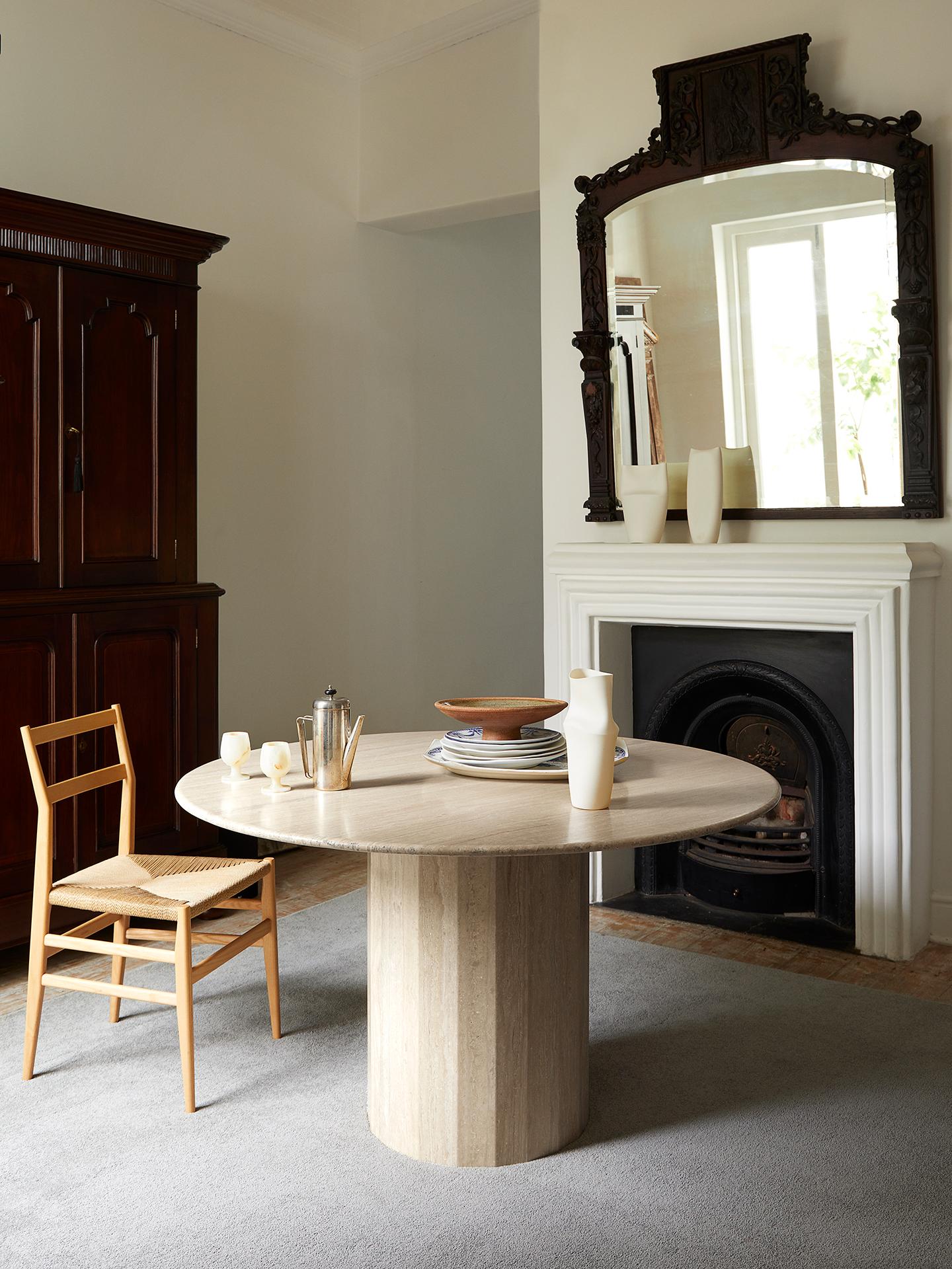 The Ashby Travertine round dining table is evidence of Lemon’s journey into increasing simplicity. With a design cued entirely by honed and filled Travertine, its round slim top is countered by a strong faceted base – an intentional and definitive