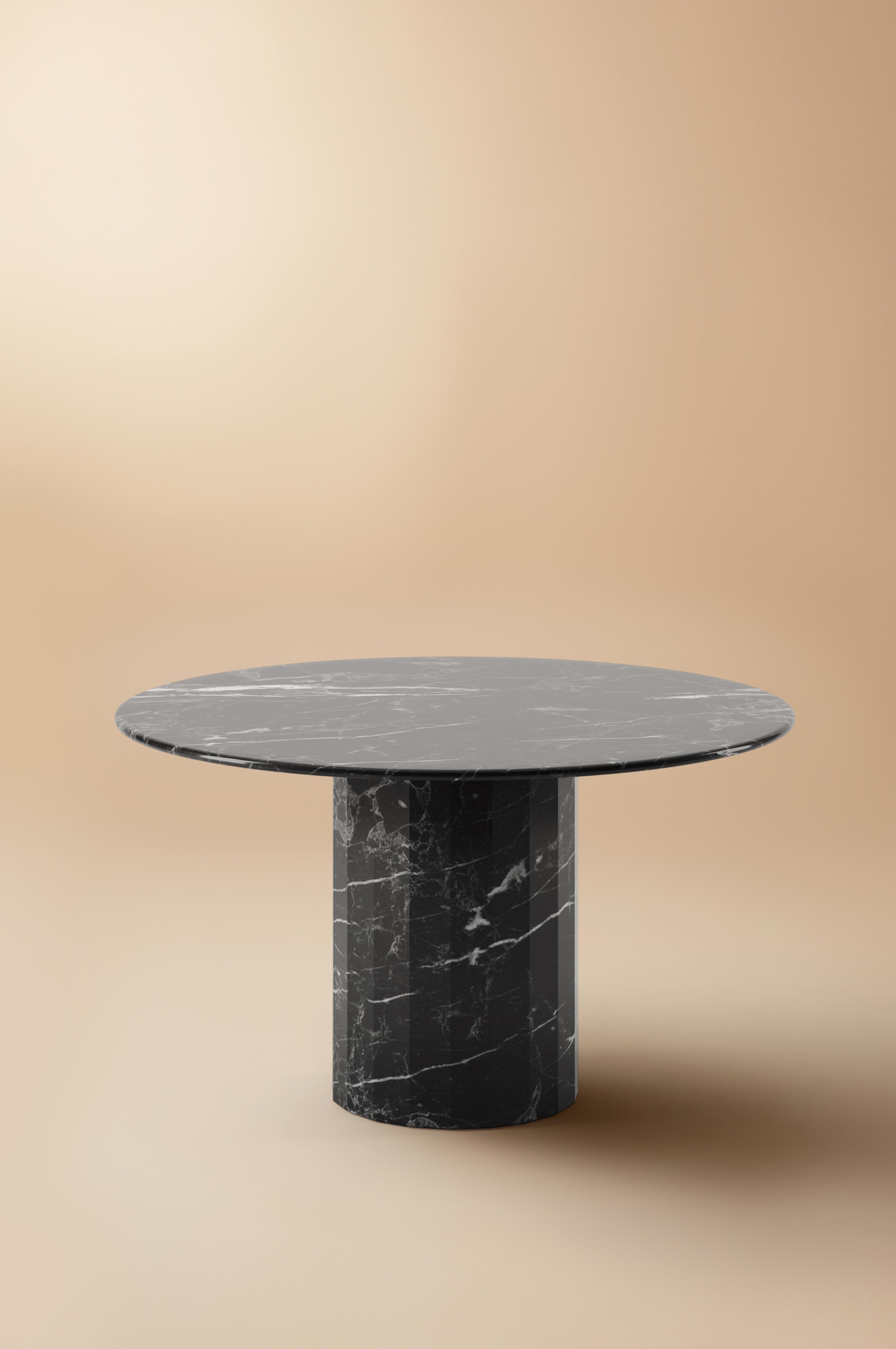 The Ashby marble round dining table is evidence of Lemon’s journey into increasing simplicity. With a design cued entirely by polished marble, its round slim top is countered by a strong faceted base – an intentional and definitive design detail.