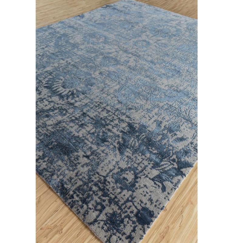 This hand knotted rug from our Chaos Theory By Kavi collection is a stunning blend of contemporary design and traditional craftsmanship. This rug features a gorgeous pattern in shades of indigo blue, inspired by the rich hues of natural indigo dyes,
