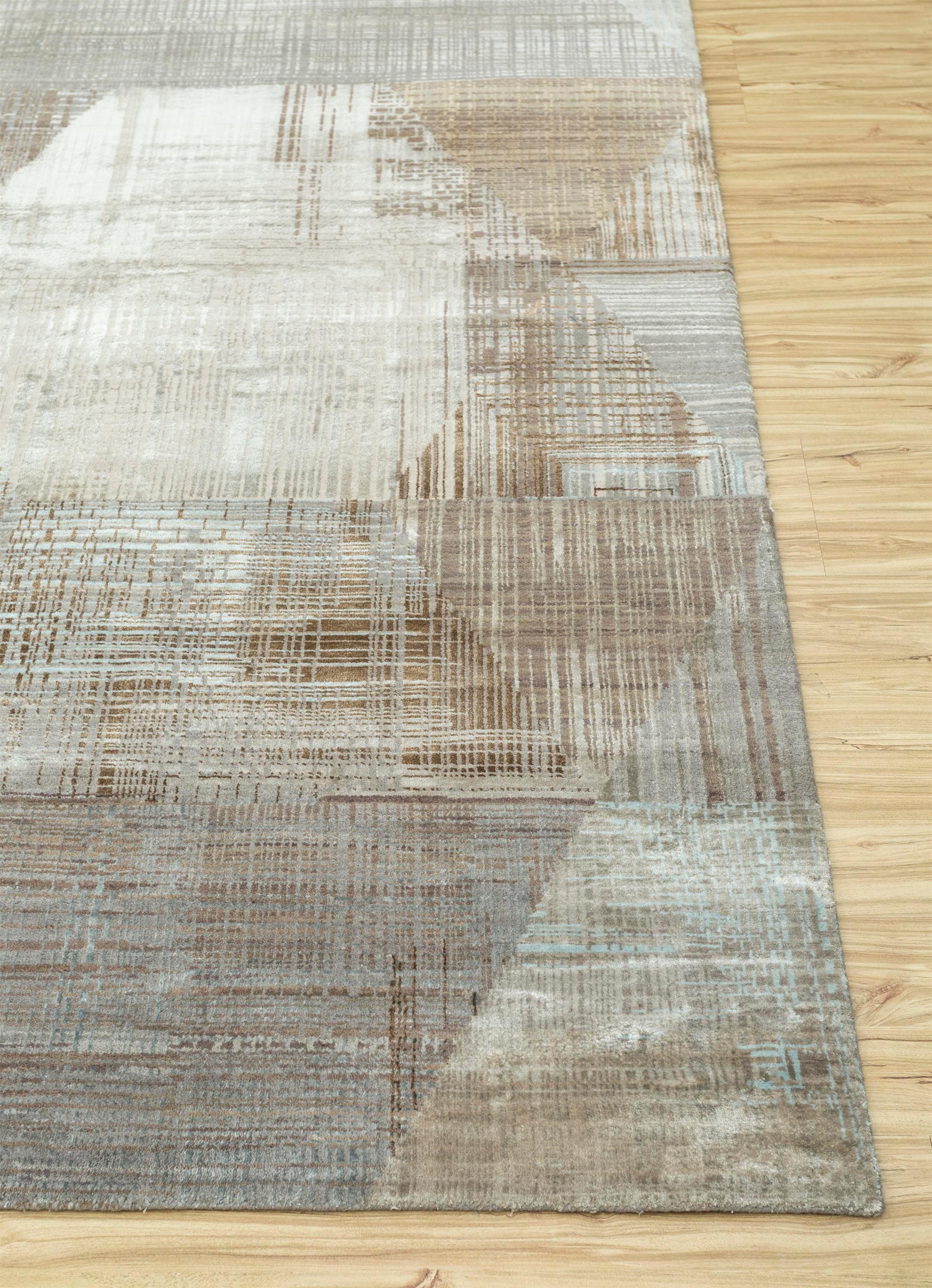 Unveil the enchanting tale within this modern, hand-knotted rug , meticulously crafted from wool and bamboo silk, echoing the artisanal whispers of rural India. The ground color, reminiscent of warm ashwood, seamlessly intertwines with an antique