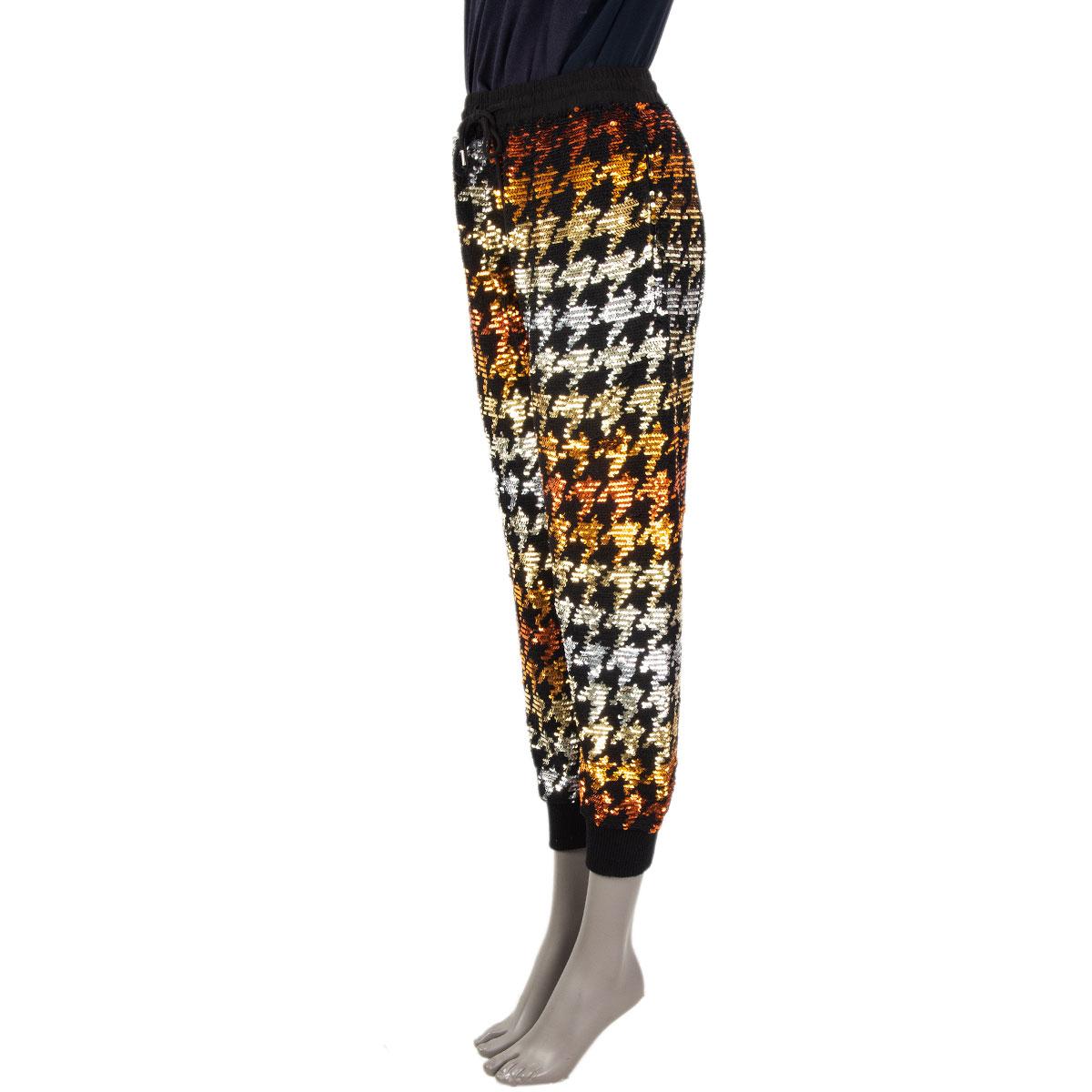 100% authentic Ashish houndstooth track pants in multicolor sequins. Has two front zip pockets. Drawstring closue. Lined in silk (assumingly as tag is missing). Have been worn and are in excellent condition. 

Measurements
Tag