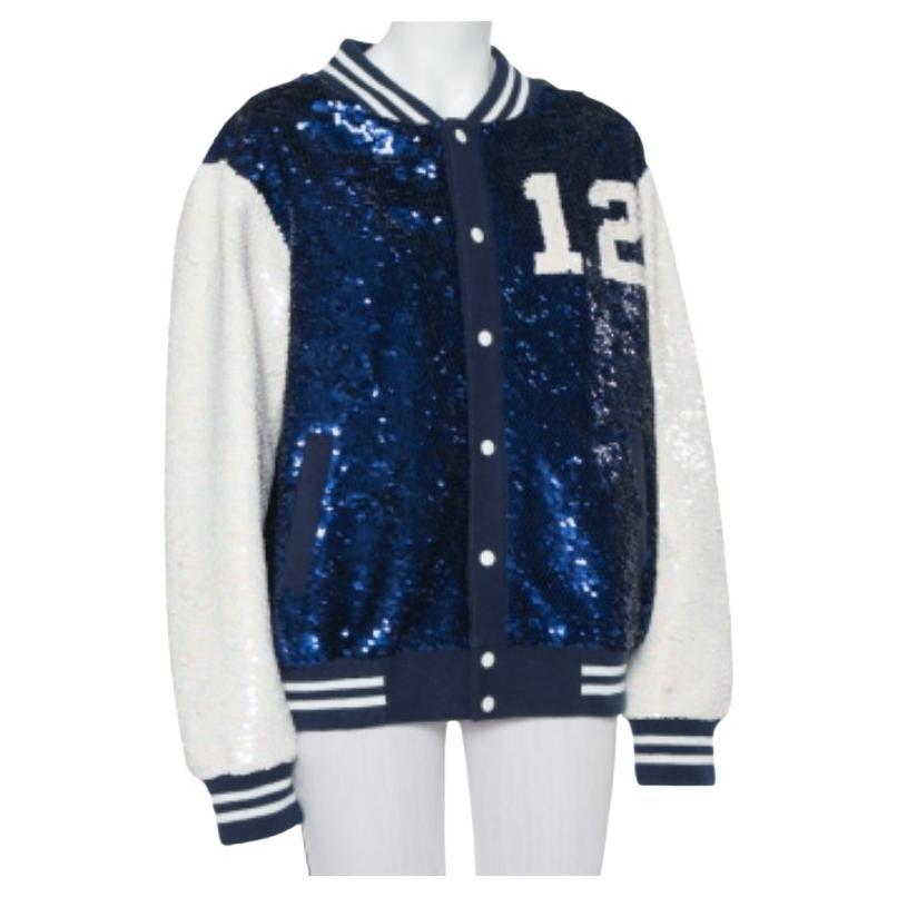 This amazing jacket from Ashish is incredibly chic and effortlessly stylish. The navy blue and white creation is designed in a relaxed silhouette with striped ribbed collars and bottom hems. Embellished with dazzling sequins all over, it flaunts the