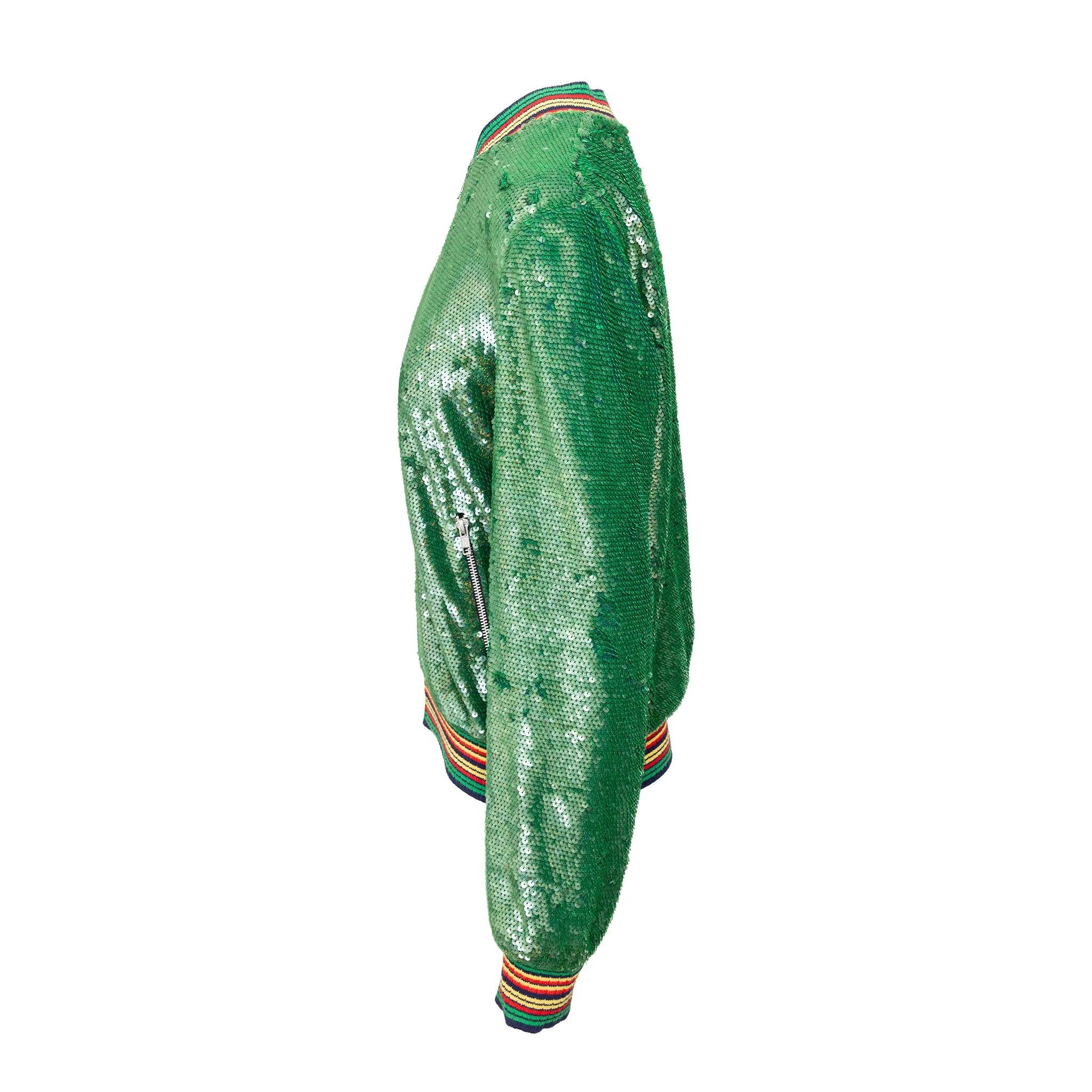 Ashish bomber jacket with green sequins hand-embroidered on cotton. Features zip closure, zip pockets, and ribbed collar and hem. Bold, crafted statement. 
 Remarks: Some sequins are missing but not visible. Pilling on the lining. 
 Material: Cotton
