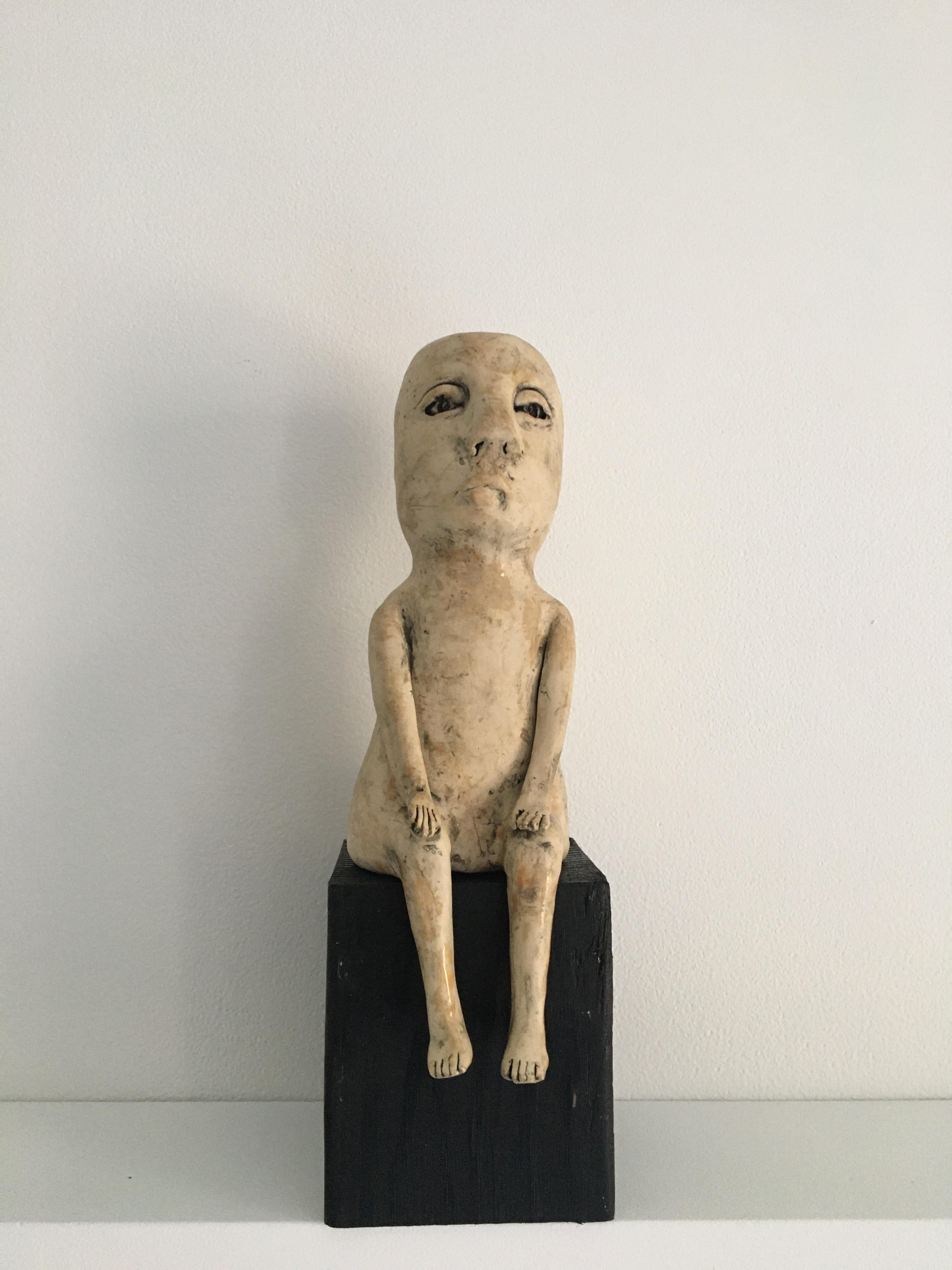 Ashley Benton Figurative Sculpture - Ceramic figure on wood block: 'Enough of this'