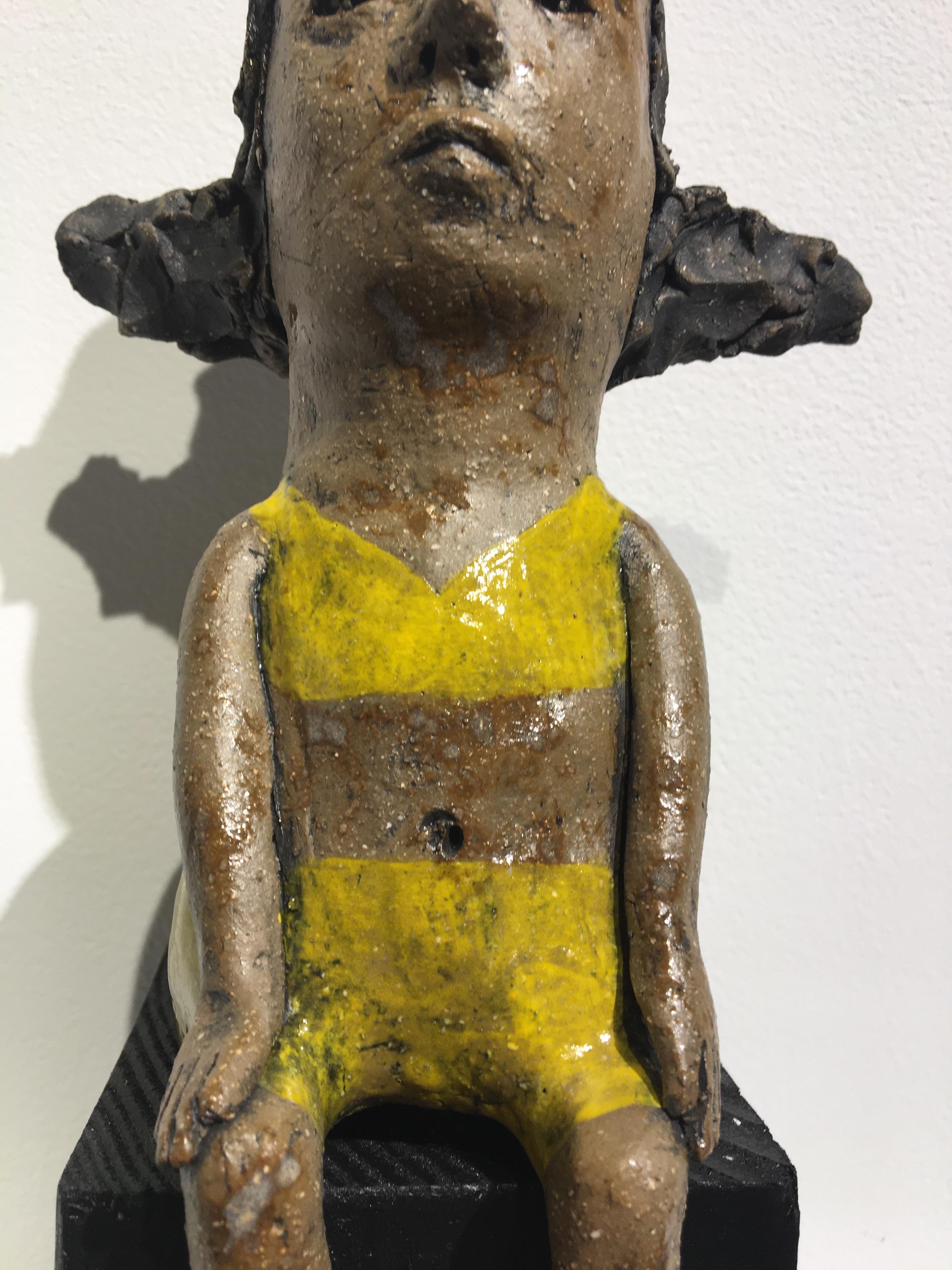 Ceramic figure on wood block: 'Hush up and hold me tight' 2