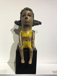 Ceramic figure on wood block: 'Hush up and hold me tight'