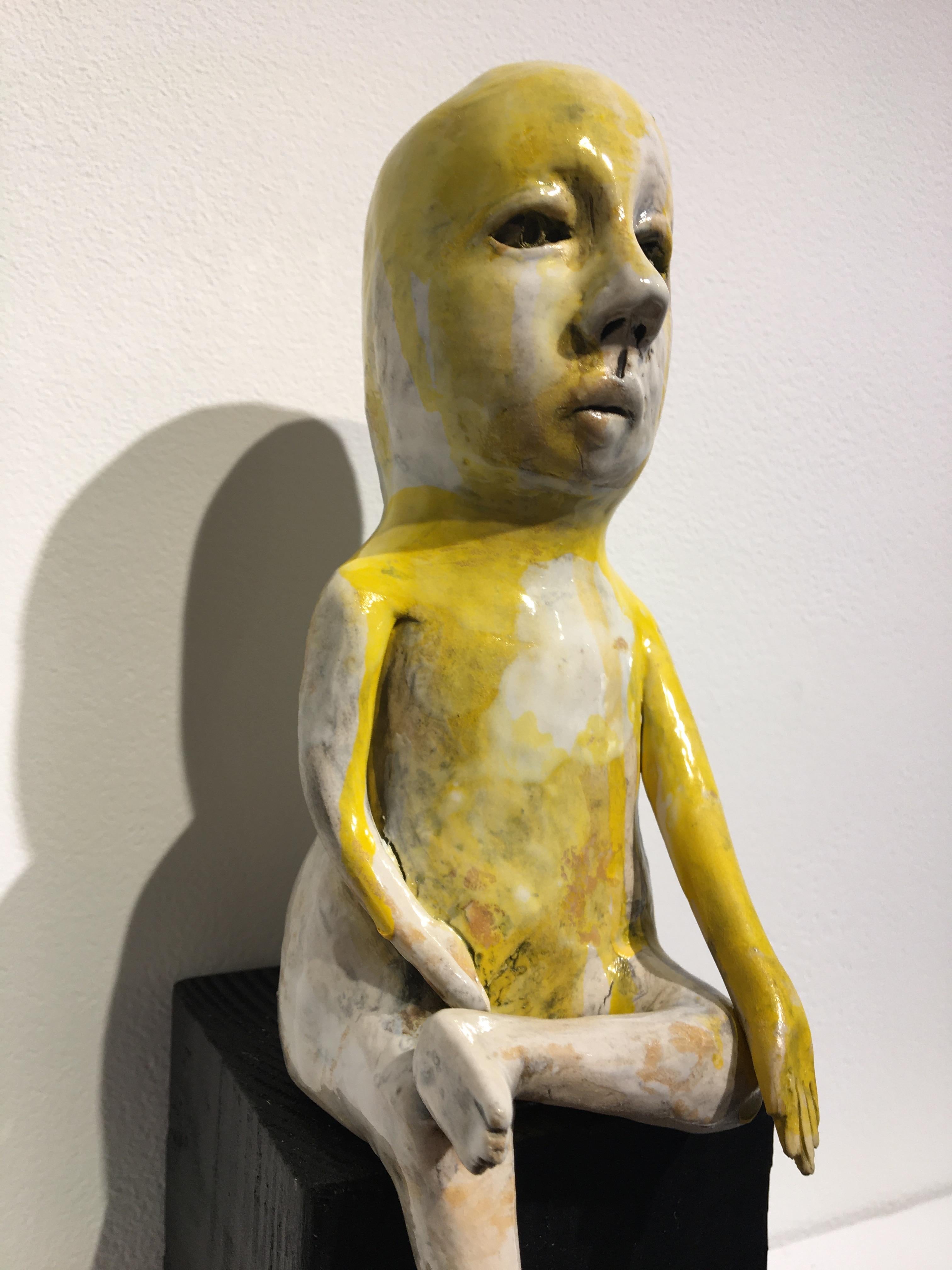 Ceramic figure on wood block: 'Varada mudra boy' 1