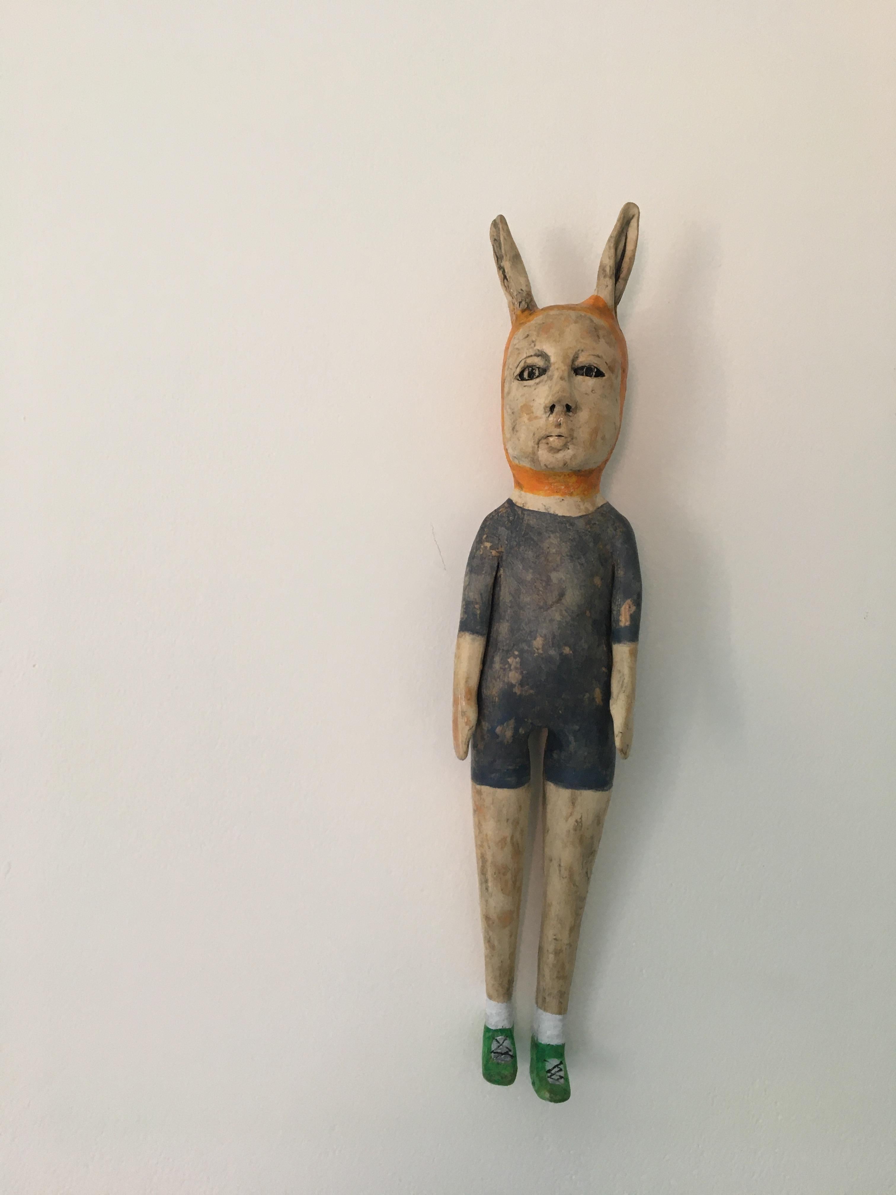 Ashley Benton Figurative Sculpture - Ceramic wall hanging: 'In 6th grade I got a pair of Nikes that were fast'