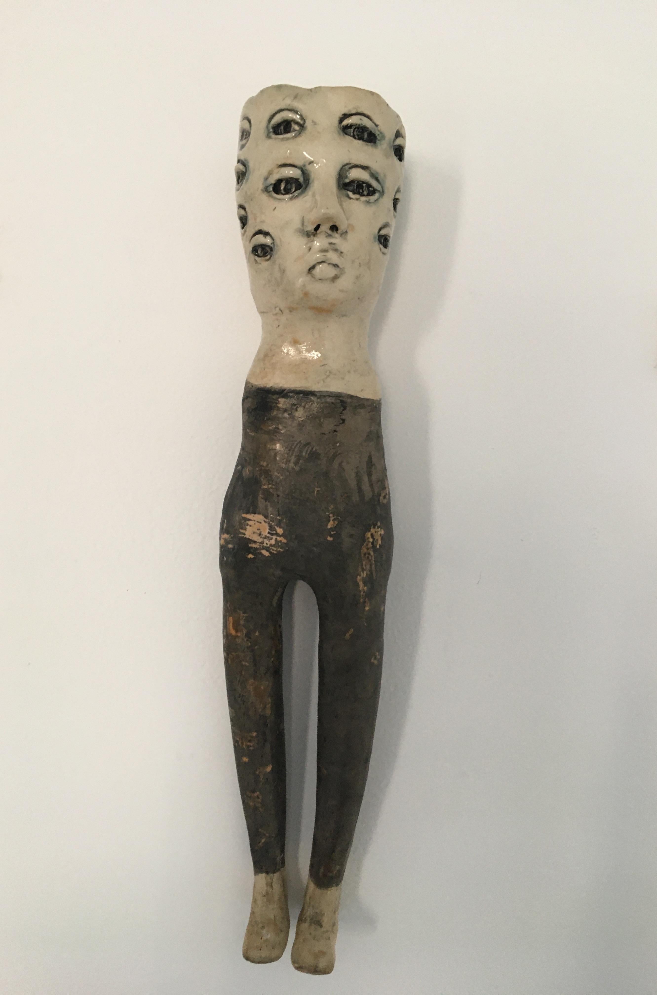 Ashley Benton Figurative Sculpture - Ceramic wall hanging sculpture: 'Keep searching'