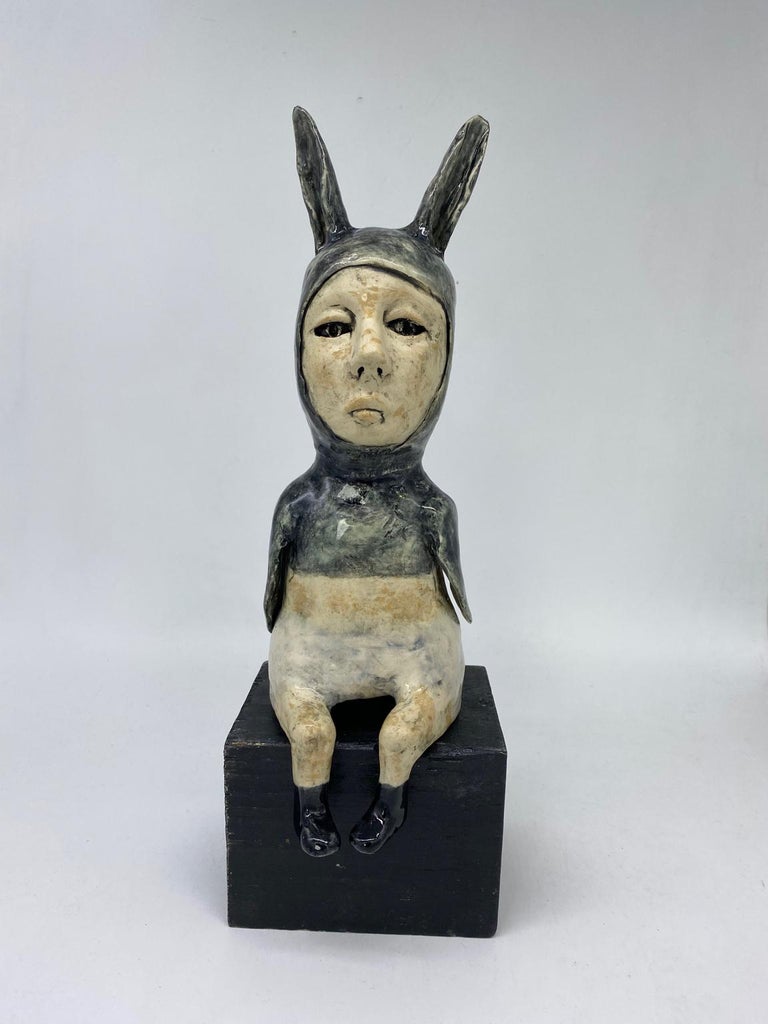 Ashley Rabbit Ashley Benton - Figurative Ceramic Sculpture: 'Black Rabbit leaving ...