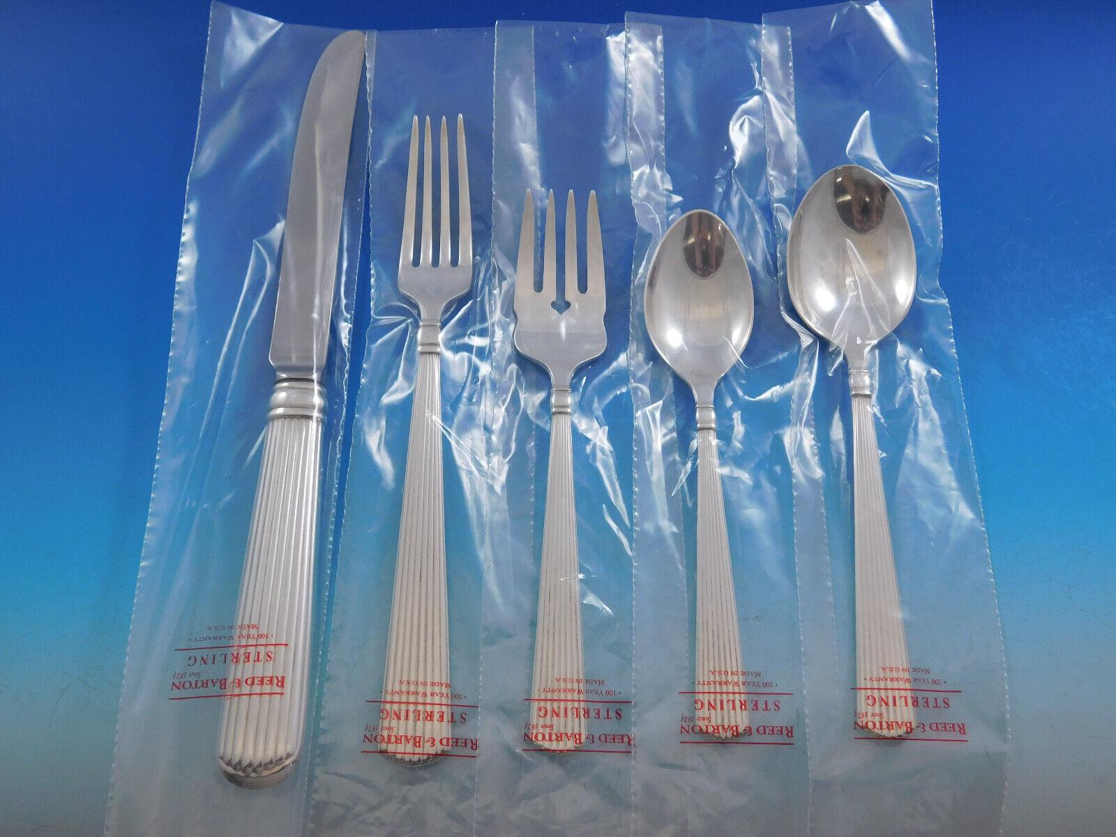 Ashmont by Reed & Barton is a sleek and heavy sterling silver flatware pattern with elegant linear fluting, providing a timeless elegance sure to enhance any tabletop.
Unused Dinner Size Ashmont by Reed & Barton sterling silver Flatware set, 66