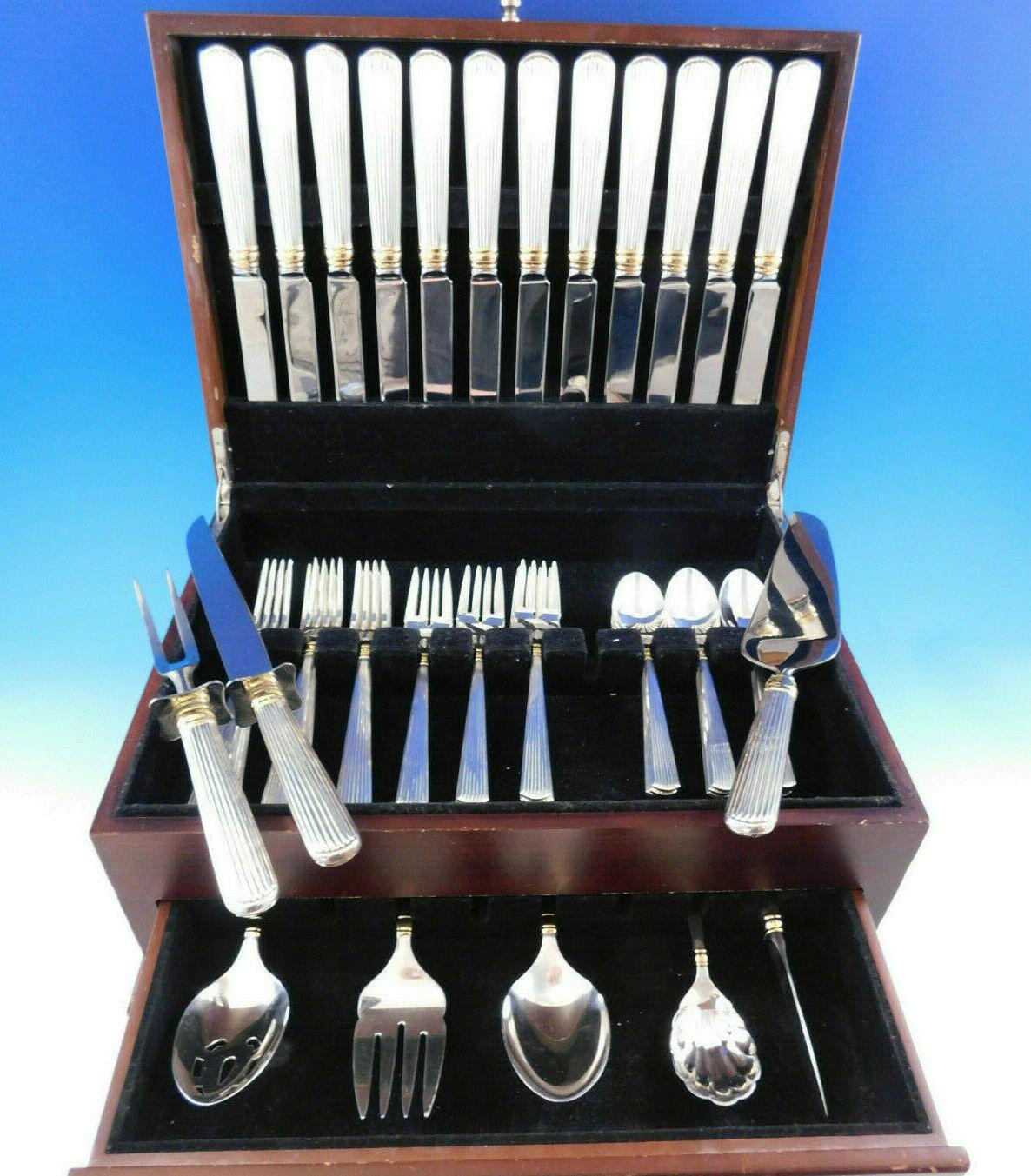 Dinner size ashmont gold by Reed & Barton sterling silver flatware set, 56 pieces. This set includes:

12 dinner size knives, 9 7/8