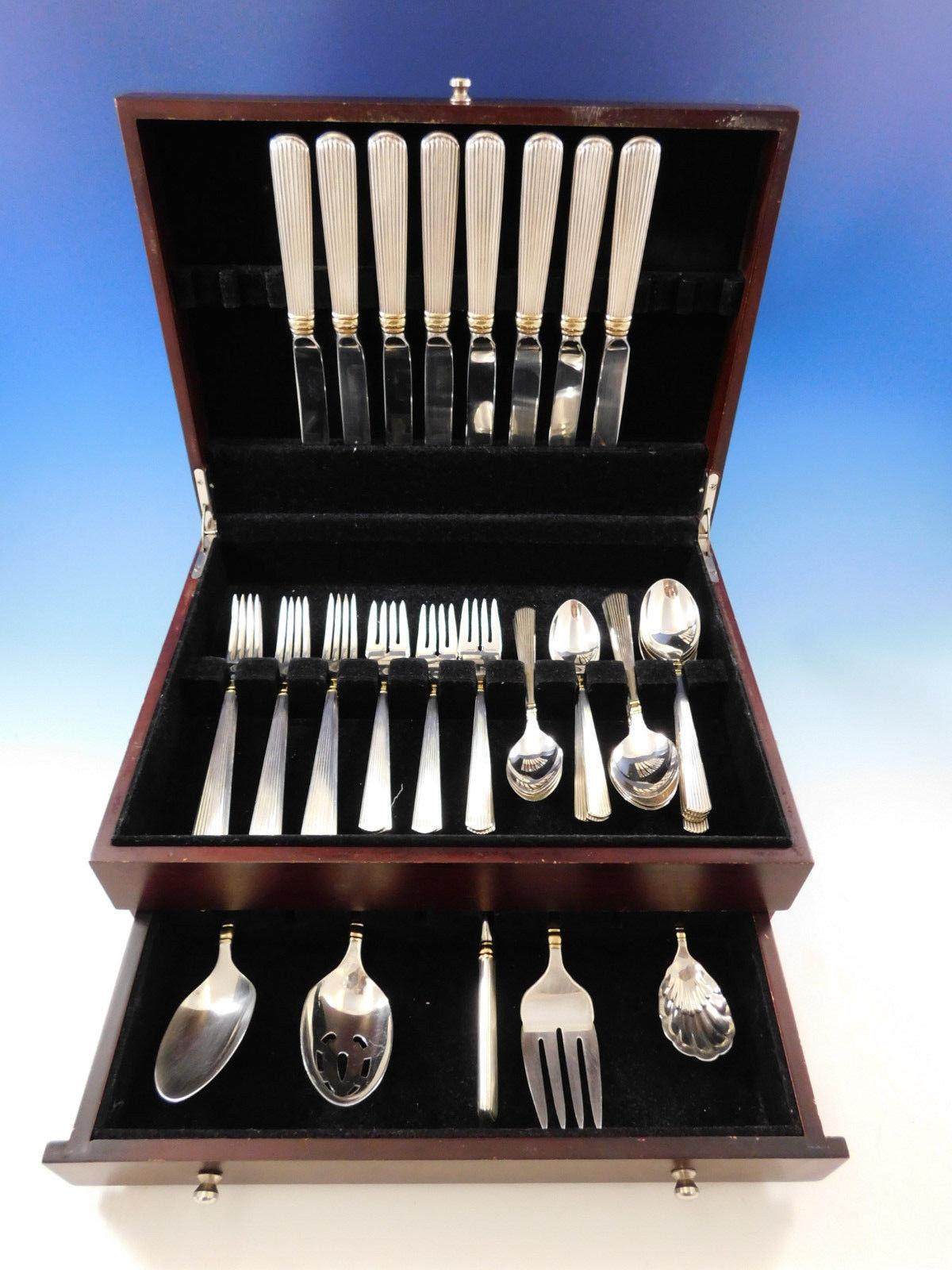 Dinner size golden ashmont (Gold accent) by Reed & Barton sterling silver Flatware set, 45 pieces. This set includes:

8 dinner size knives, 9 7/8