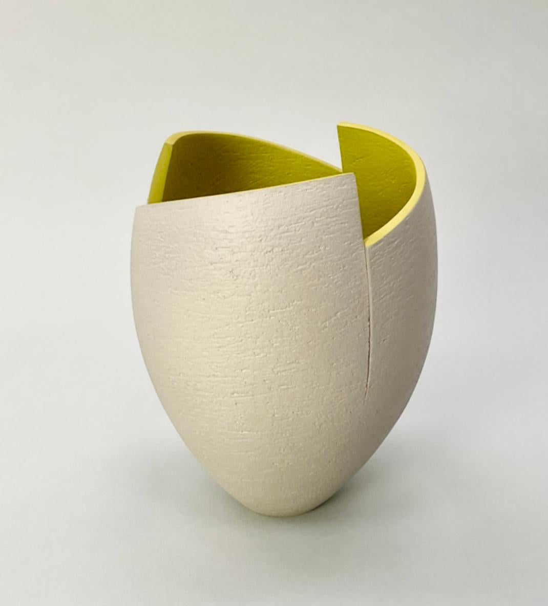 Grey cut and altered vessel with chartreuse interior