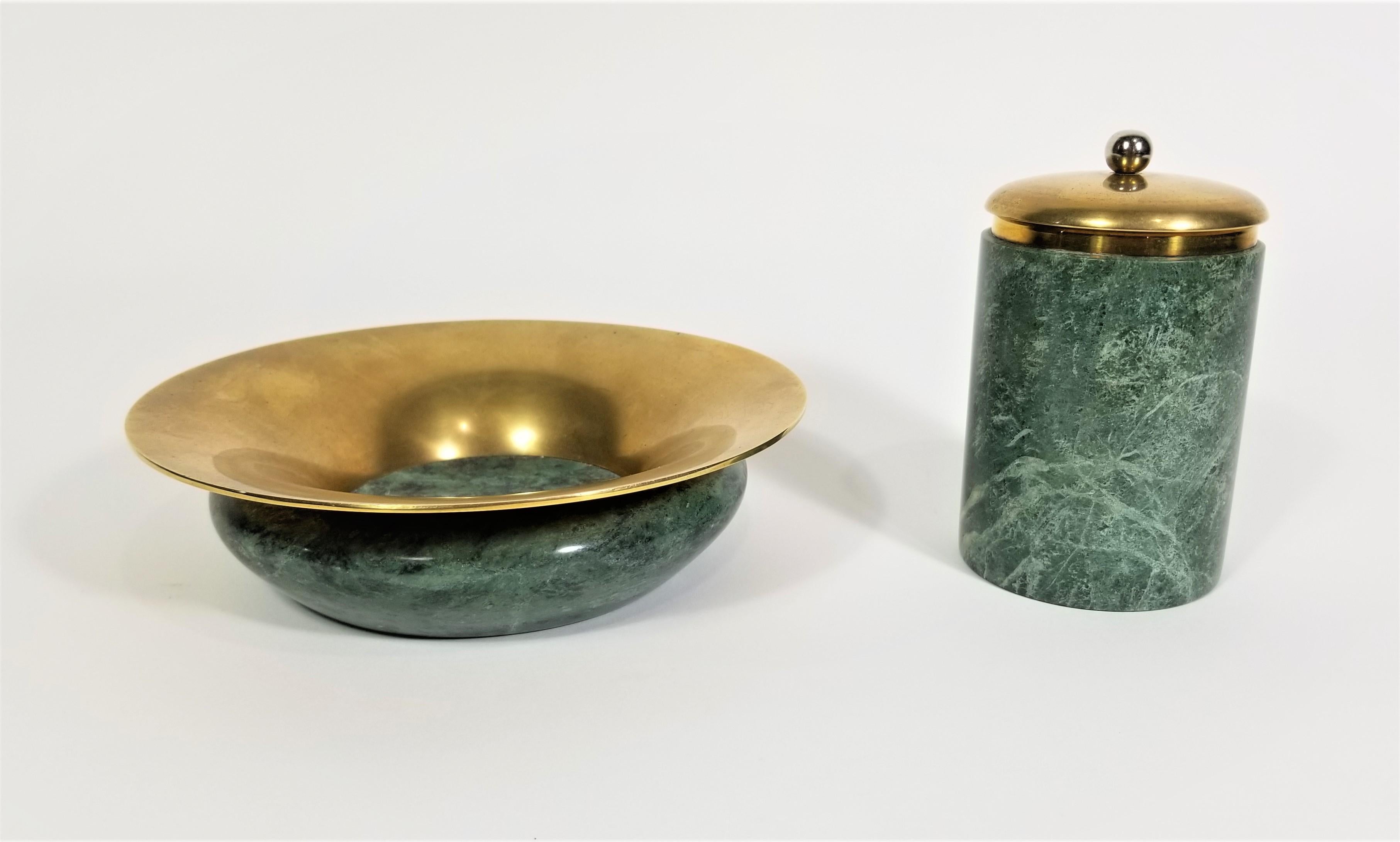 1970s 1980s Ashtray or bowl and Lidded Holder. 
Green Marble and Brass. 

Measurements:
Ashtray / Bowl Height: 2.0 inches
Ashtray / bowl Diameter: 7.0 inches

Holder Height: 4.63 inches
Holder Diameter: 2.75 inches.