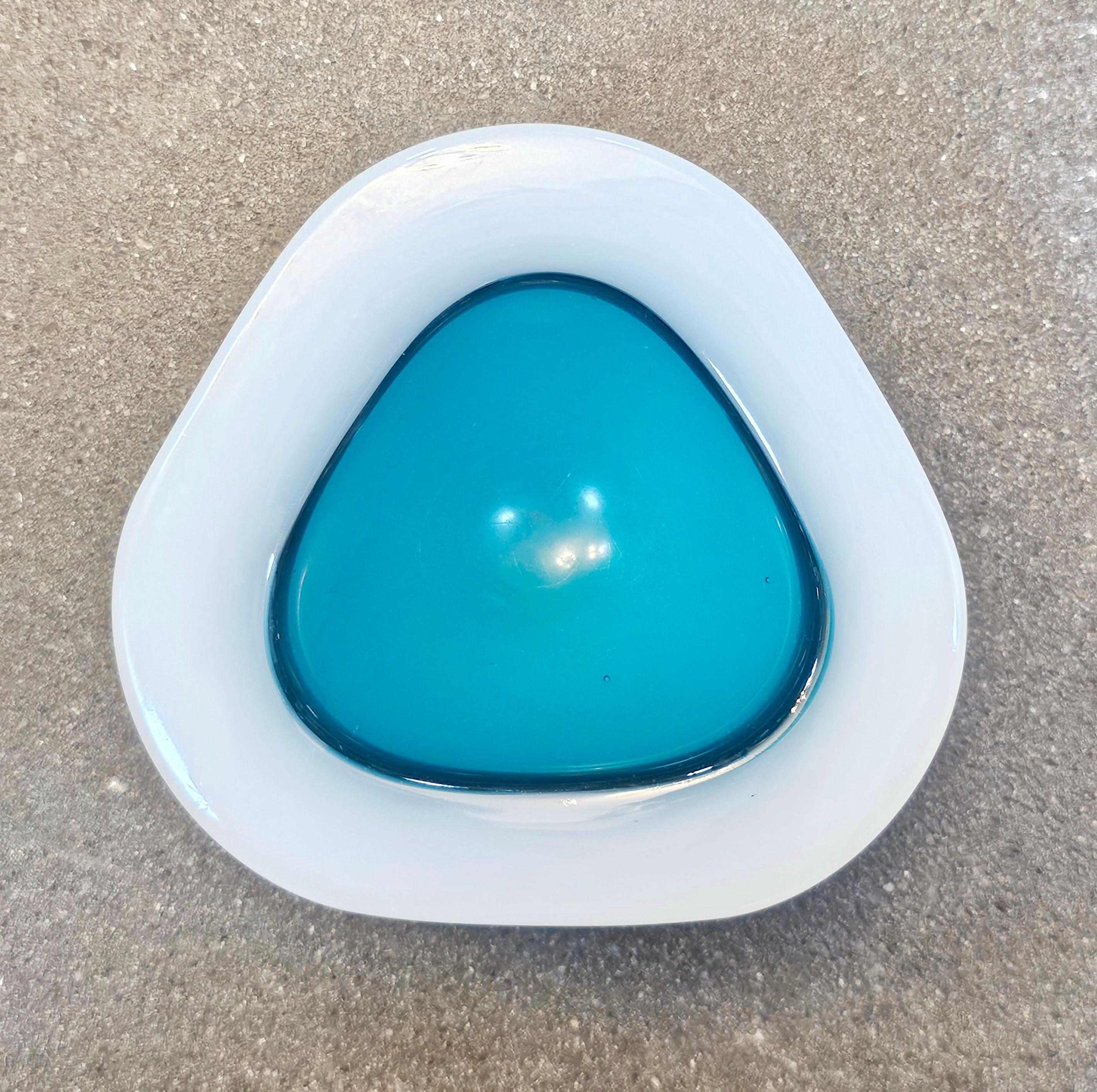 In this listing you will find a very rare Ashtray designed by Archimede Seguso in Opaline and Turquoise Murano Glass. It features beautiful triangular shape with round edges. Made in Italy in 1950s.

Ashtray is in a good vintage vintage condition