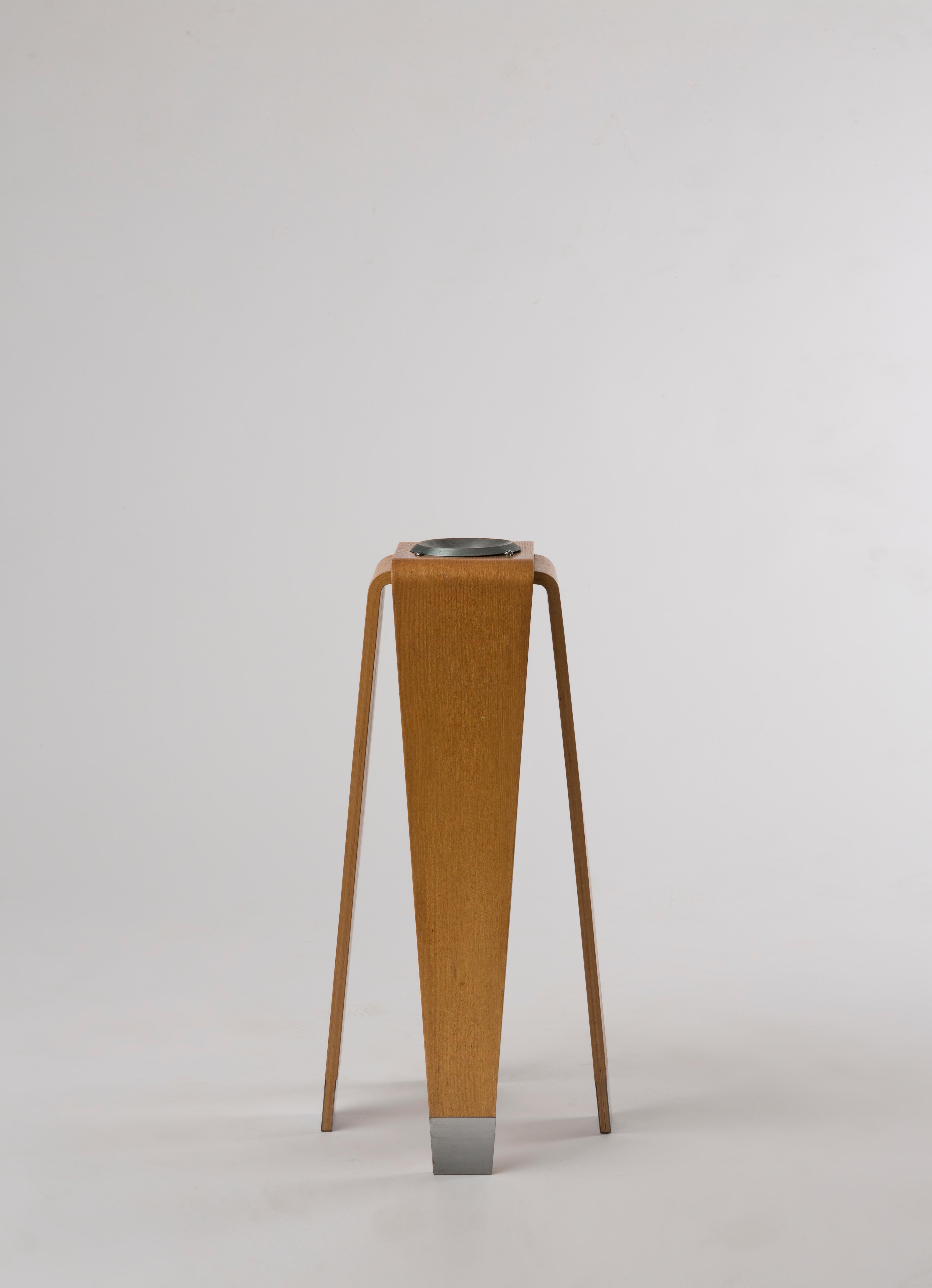 An ashtray on a stand by the Japanese architect and designer Kenzo Tange (1913-2005), in laminated plywood and metal, manufactured by Tendo Mokko, Japan, circa 1950’s