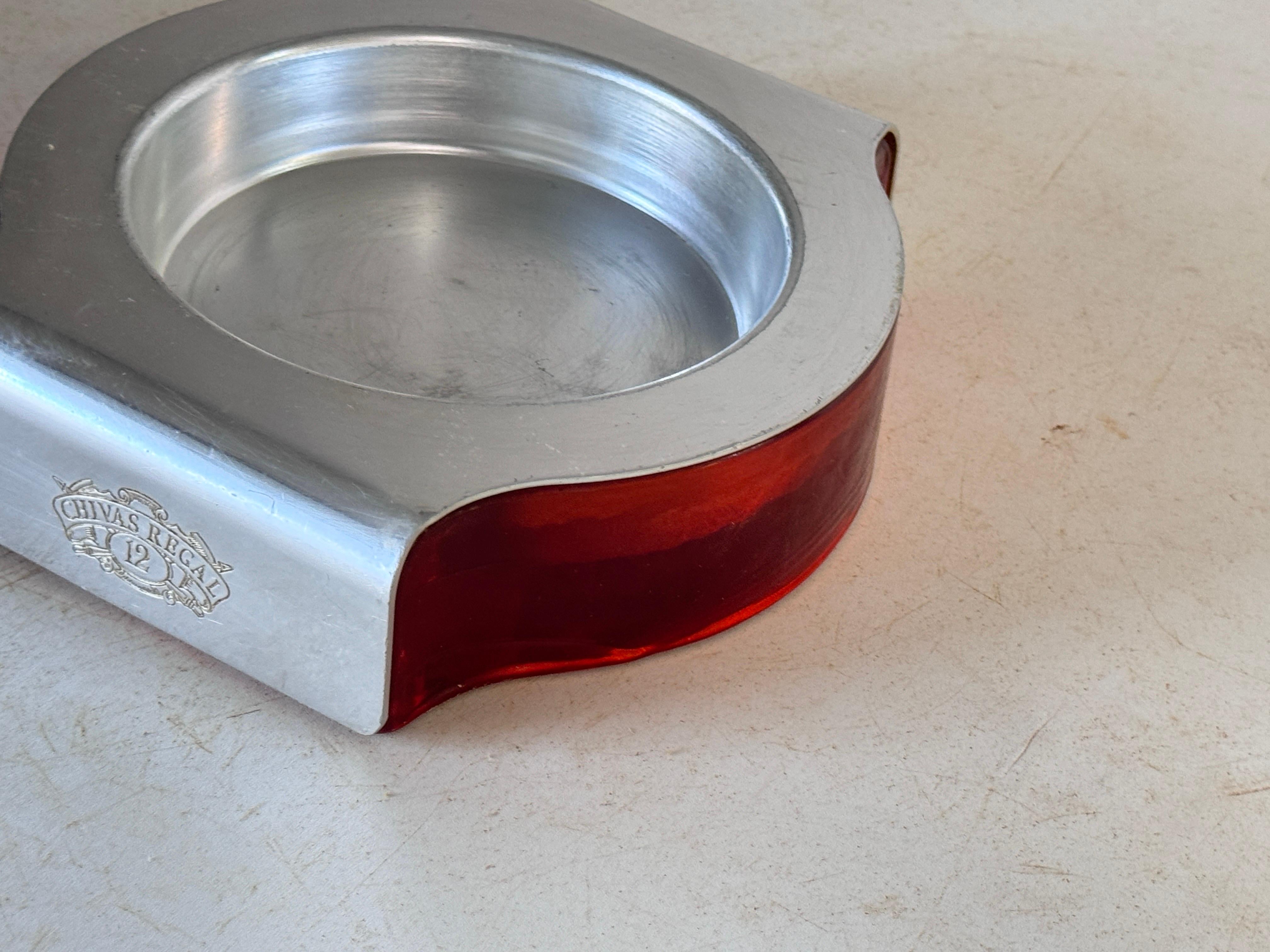 Ashtray in Glass and Aluminium. Signed Chivas
France  
Silvered and red color.
Very Heavy