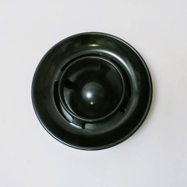 Ashtray Lotus designed by Enzo Mari and produced by Danese Milano in 1973 (out of production. In 2 parts of black melamin. Signed and dated under the base.