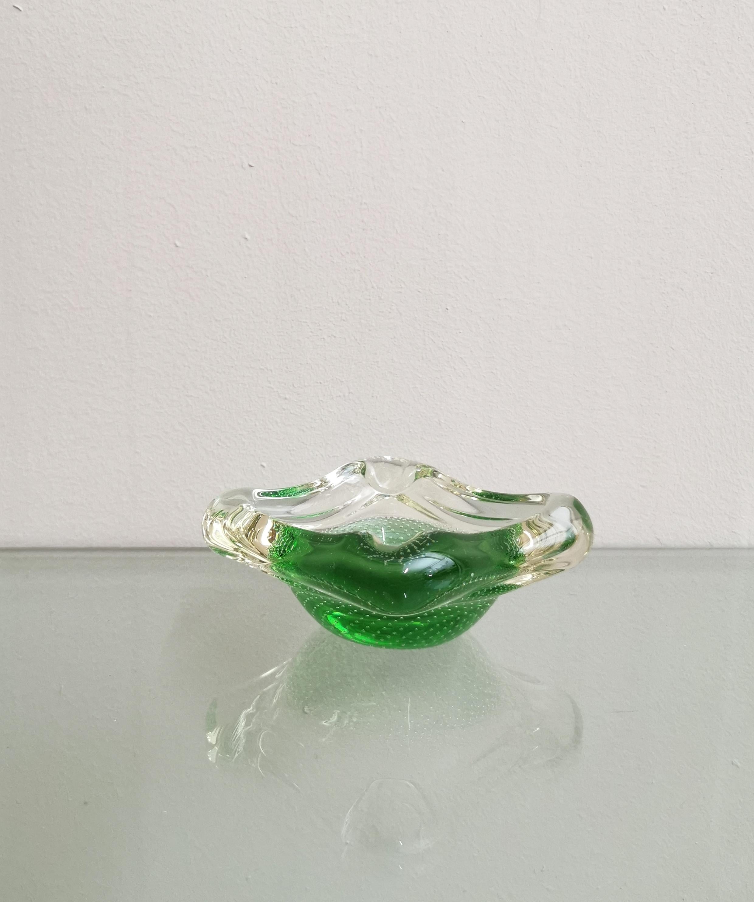 Ashtray and pocket emptier with particular shapes attributed to the renowned Italian designer Archimede Seguso produced in the 1950s. The ashtray was made of blown Murano glass with the famous sommerso technique and with the particular combination