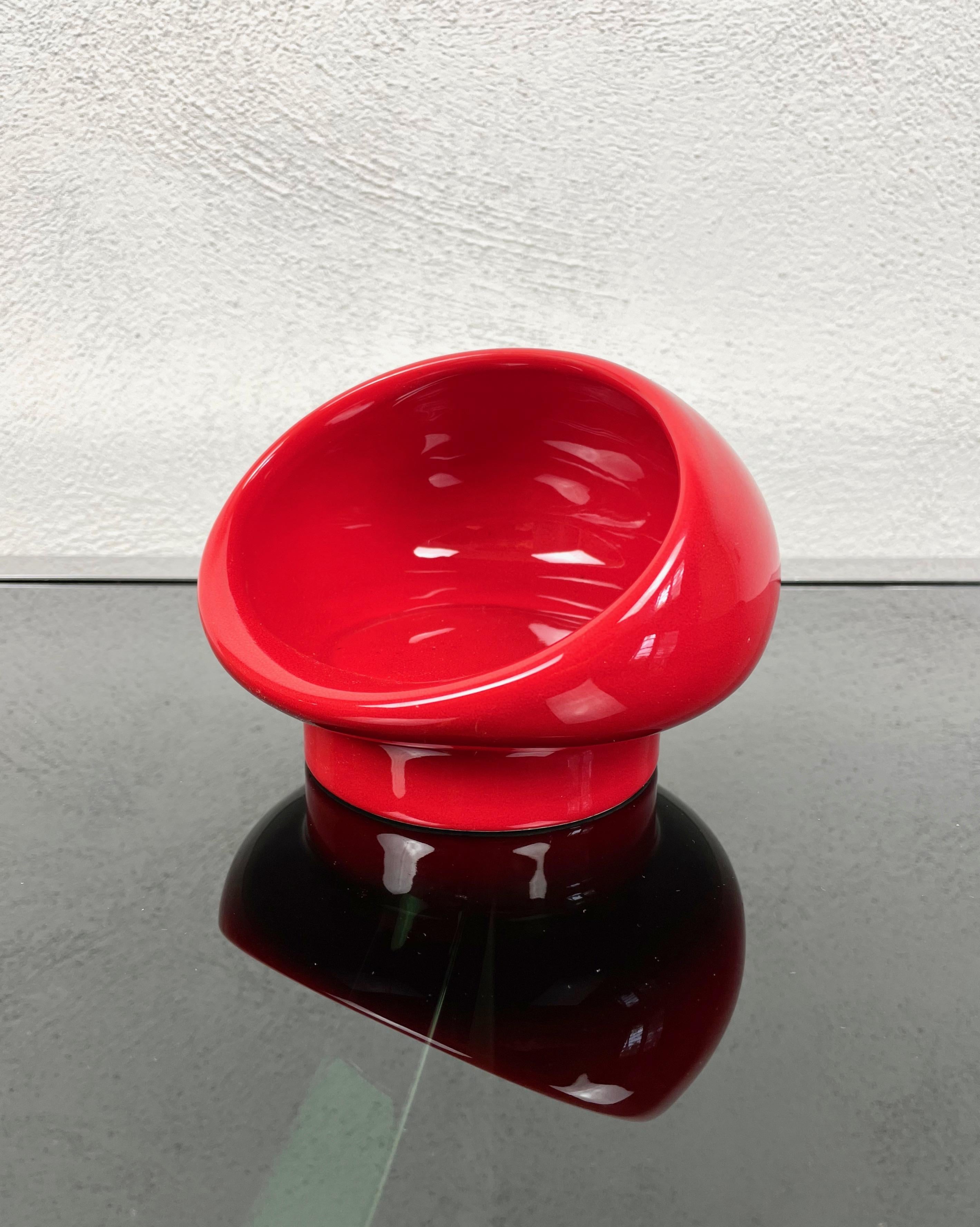 Space Age ashtray in red ceramic made by Studio OPI Gabbianelli in Italy in the 1970s. 
It comes with its original label still attached on the bottom, as shown in the photos.