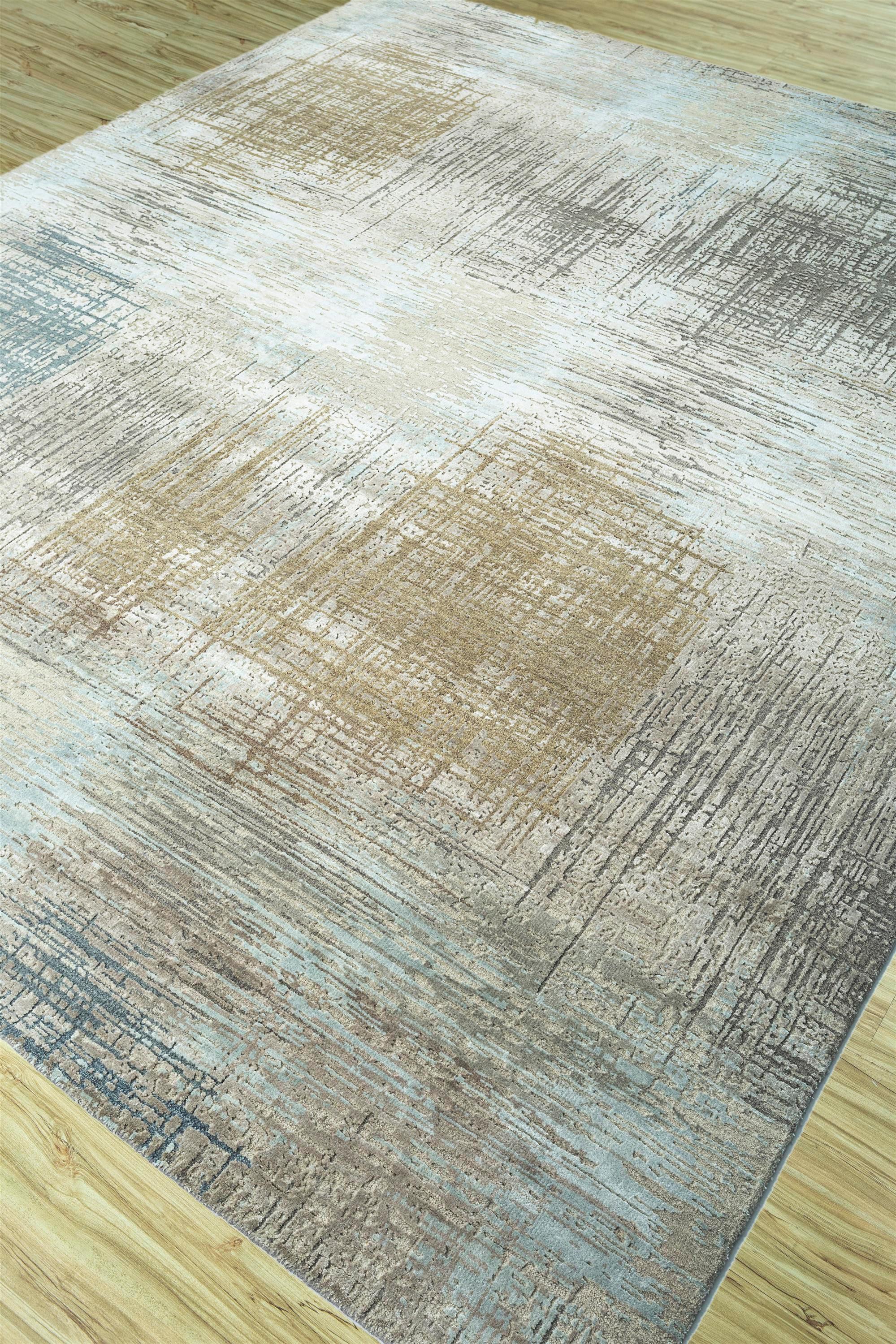 Embark on a design journey with a fusion of ashwood and skyline blue in luxurious wool and bamboo silk. Hand-knotted to perfection, this rug epitomizes modern elegance, capturing the essence of contemporary spaces. Inspired by mesh textures, this