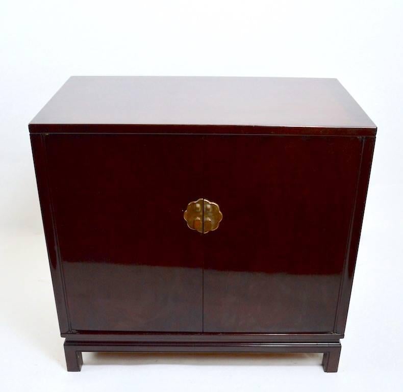 Nice diminutive server in the Chinese Style, two doors open to Revel two drawers and open storage. Manufactured by noted furniture company Landstrom Furniture Corporation. Please view the matching credenza, dining table and chairs we have listed