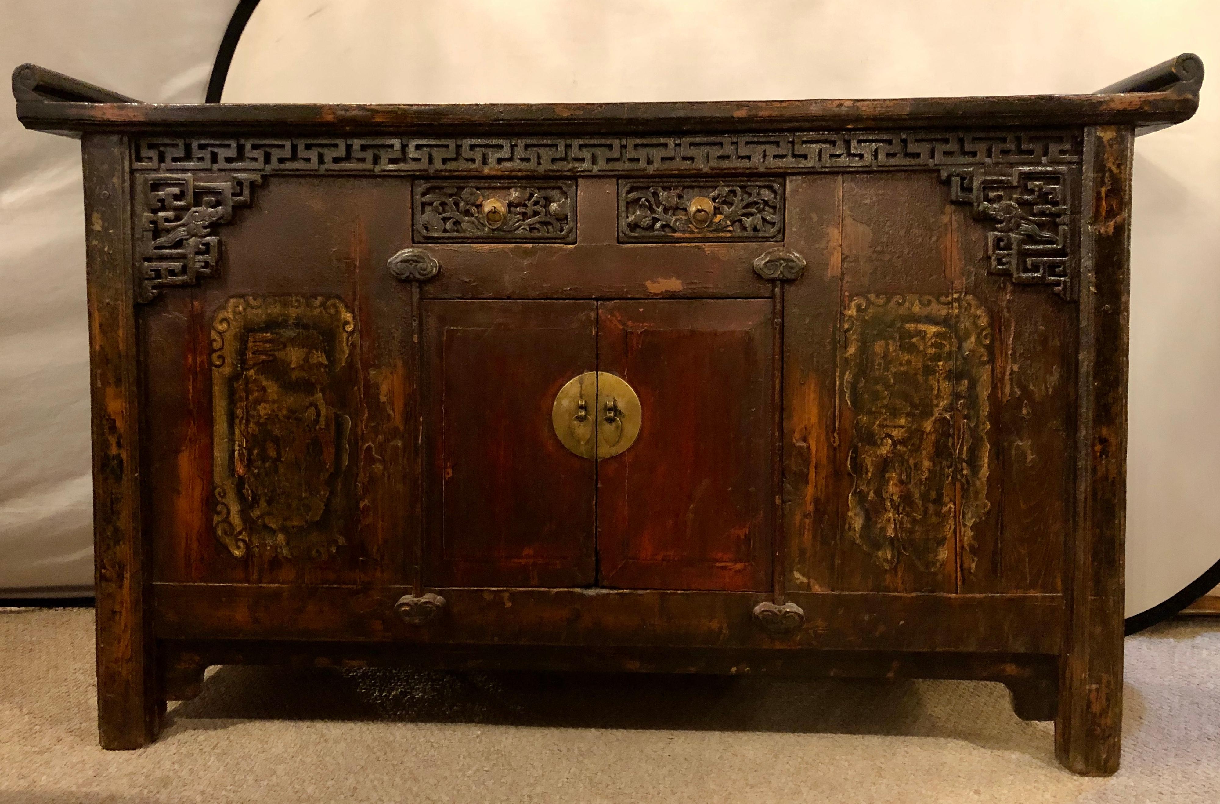 Chinese alter table, sideboard / console carved wood, early 20th century. This all original alter table or sideboard can be used in multiple places in the home. Having old world charm with its rustic look this cabinet would make a great addition to