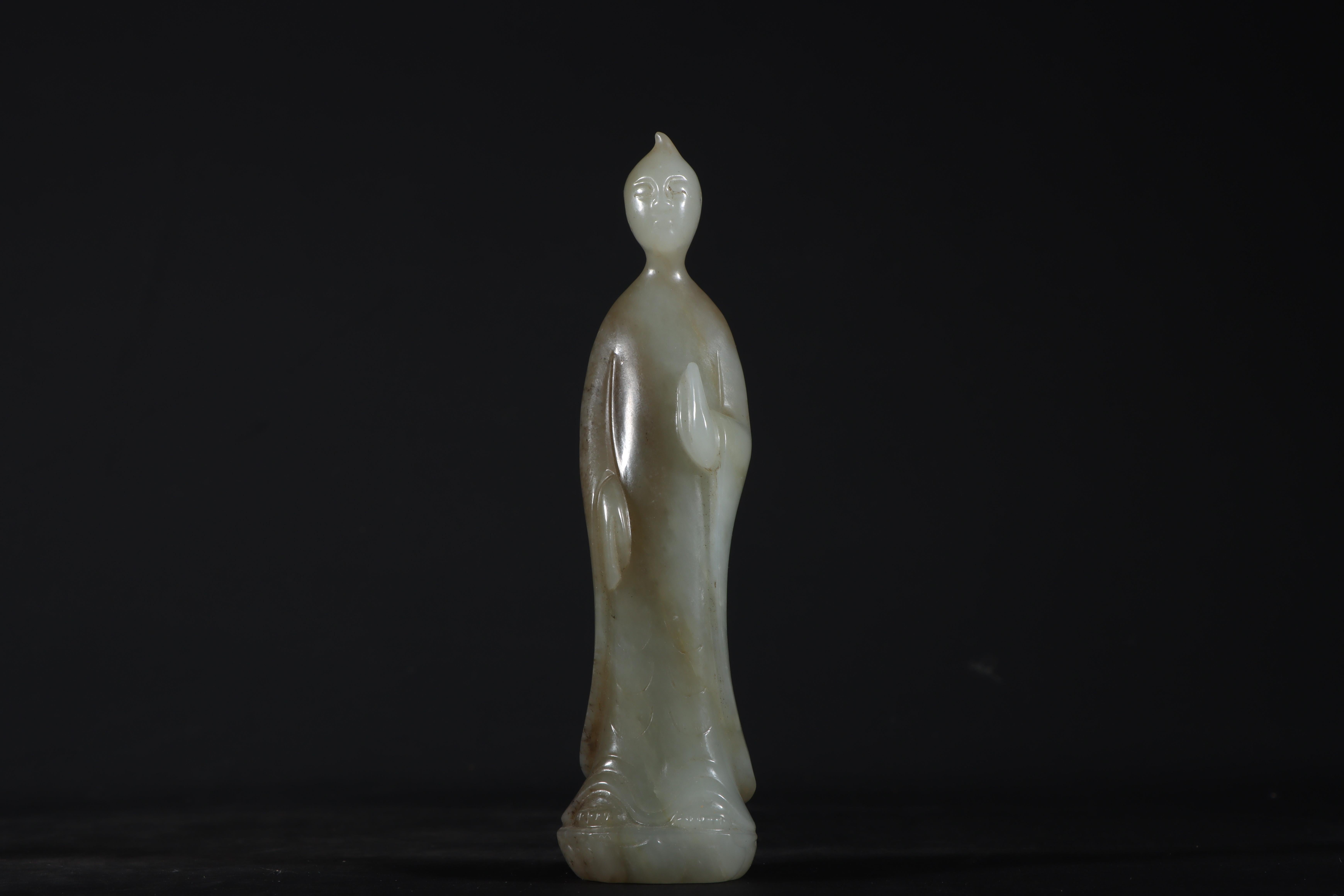 This Asian antique jade carving standing Buddha statue is a magnificent example of Eastern artistry. Crafted with intricate detail from fine jade, the serene Buddha exudes peace and wisdom. This rare collectible represents the spiritual essence of
