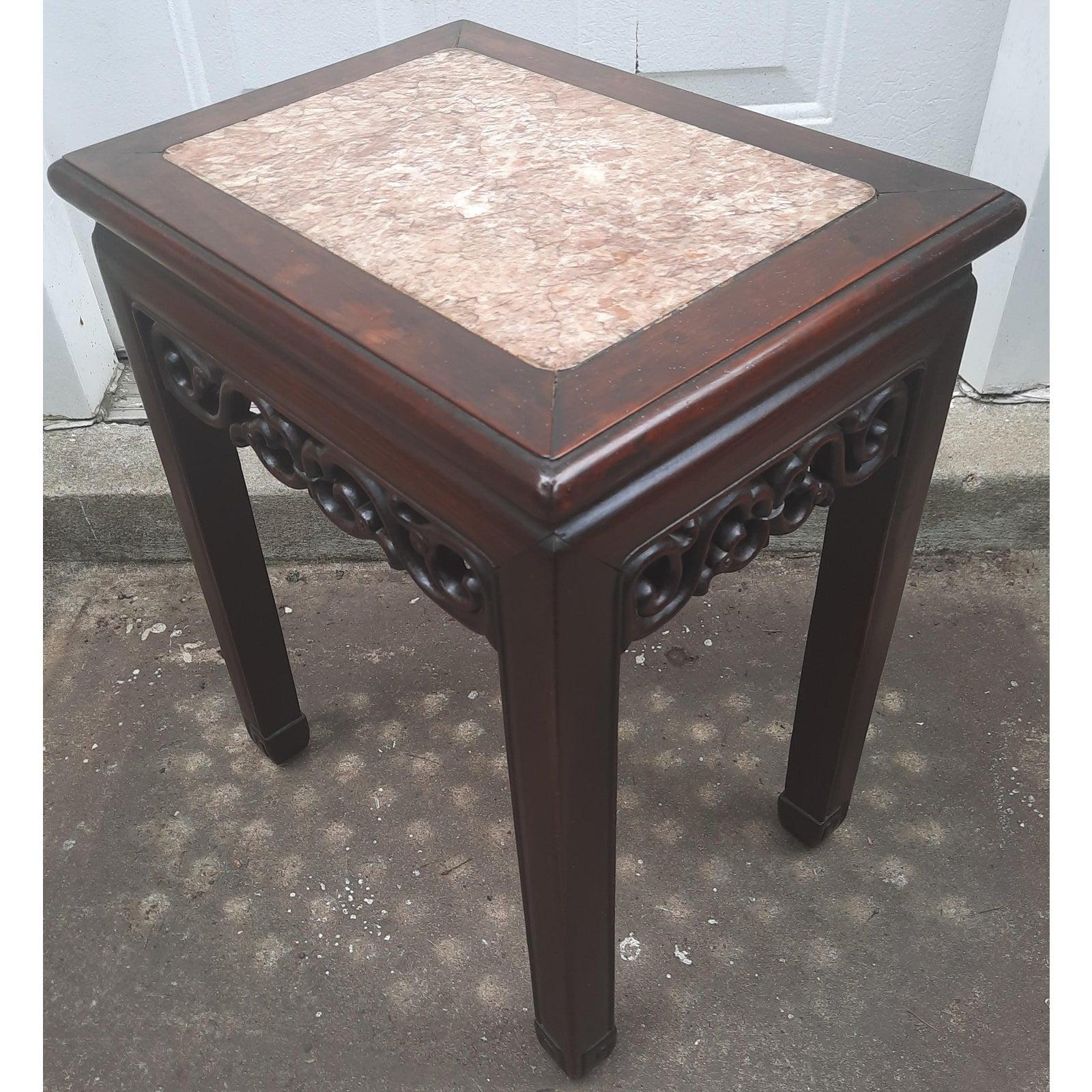 Carved Mahogany side table with rich marble top. May be used as a lamp table or as a plant stand as well.
Carved on all 4 sides. Oriental accent. Very good vintage condition. Measures 16.25