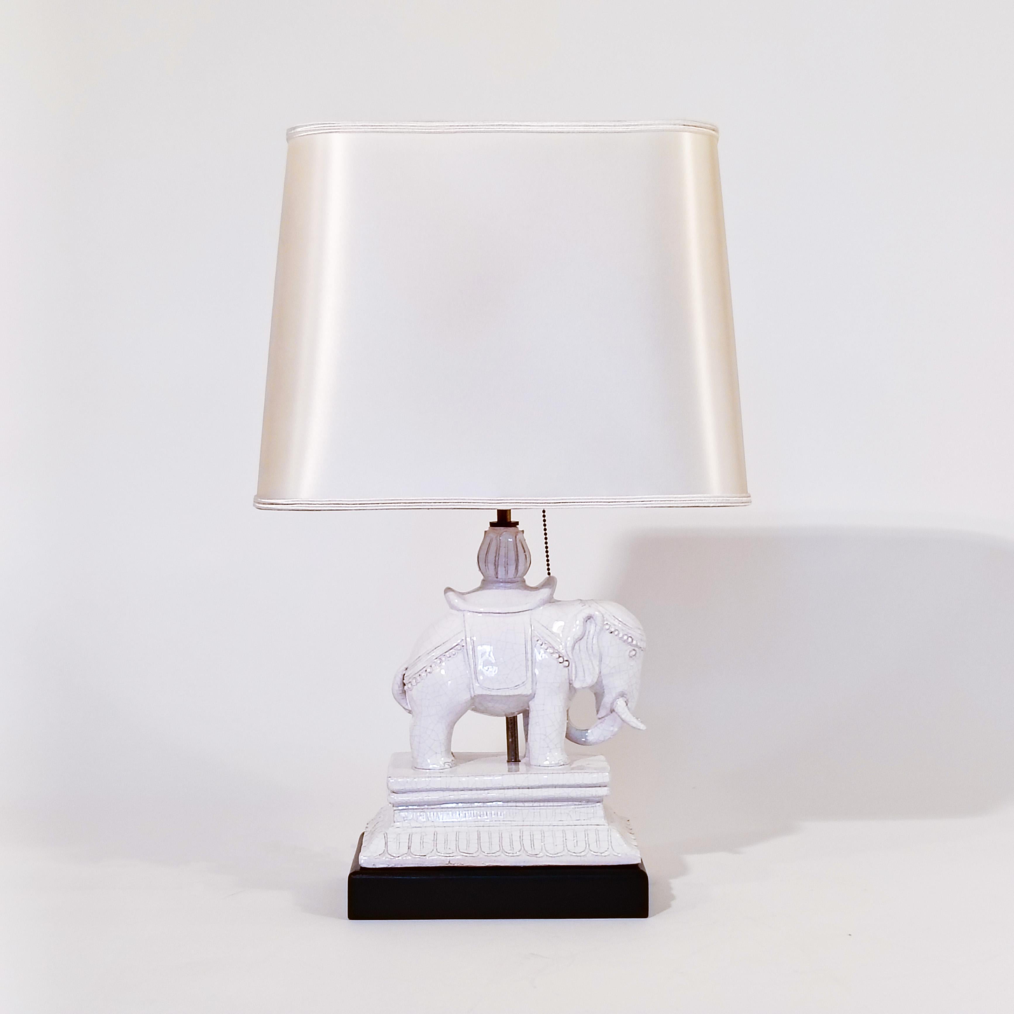 Chinoiserie style Oriental table lamp by Antonio Campuzano, Spain, 1960s. A very representative item of the authentic Asian art, handmade by this spanish sculptor. Made of crackled glazed ceramic representing a typical oriental elephant with