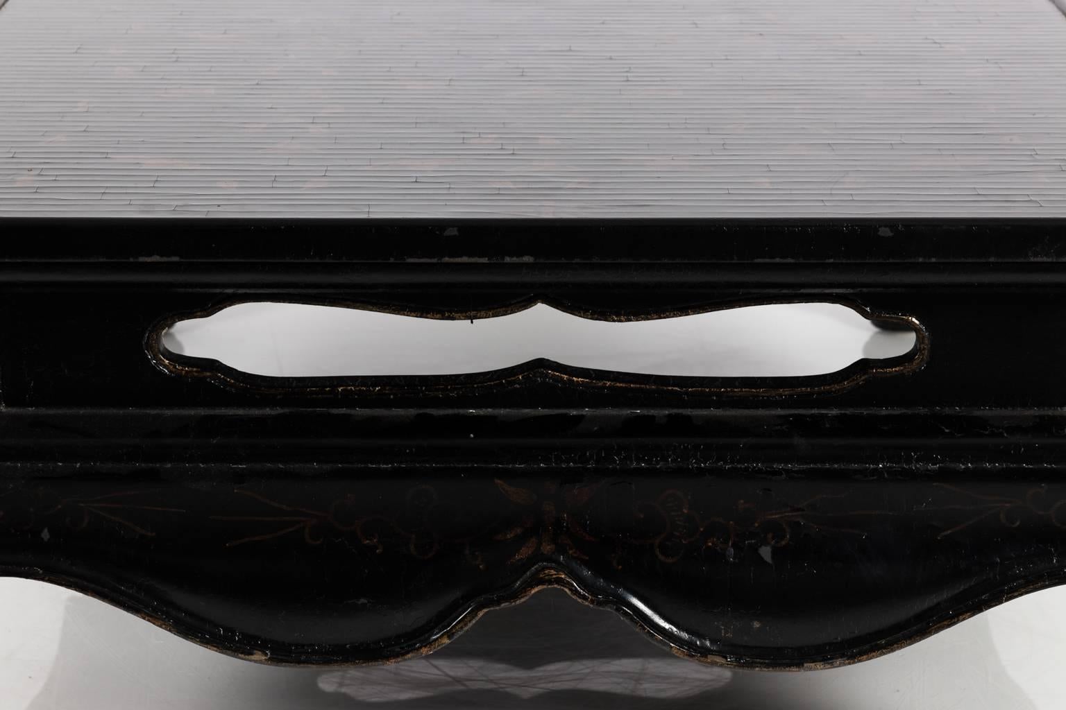 Large rectangular black lacquer Asian style coffee table. Gold lead motif on top surface.
 