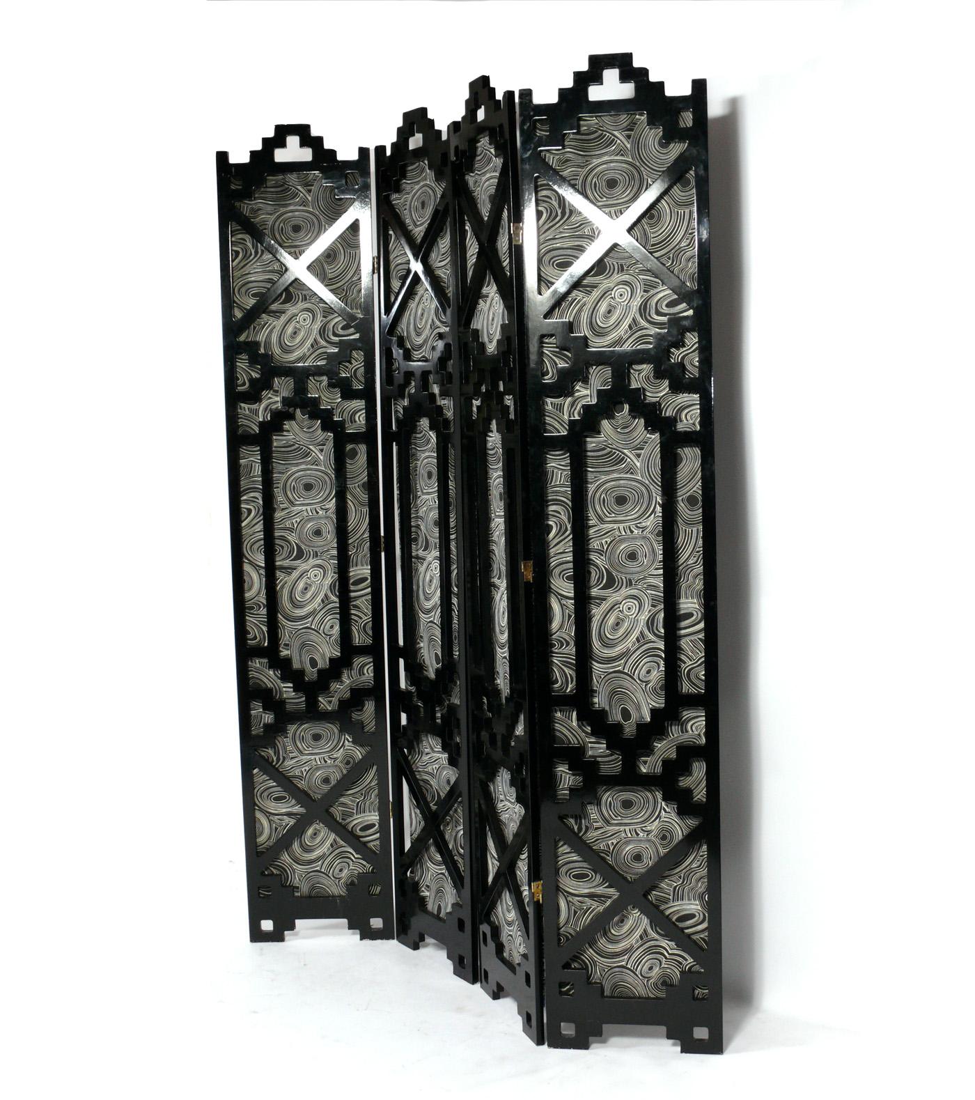 Asian black lacquer folding screen or room divider, probably Chinese, circa 1960s. It has been recently reupholstered in a black and white color malachite print fabric. It is a versatile size and can be used as a folding screen, room divider, or