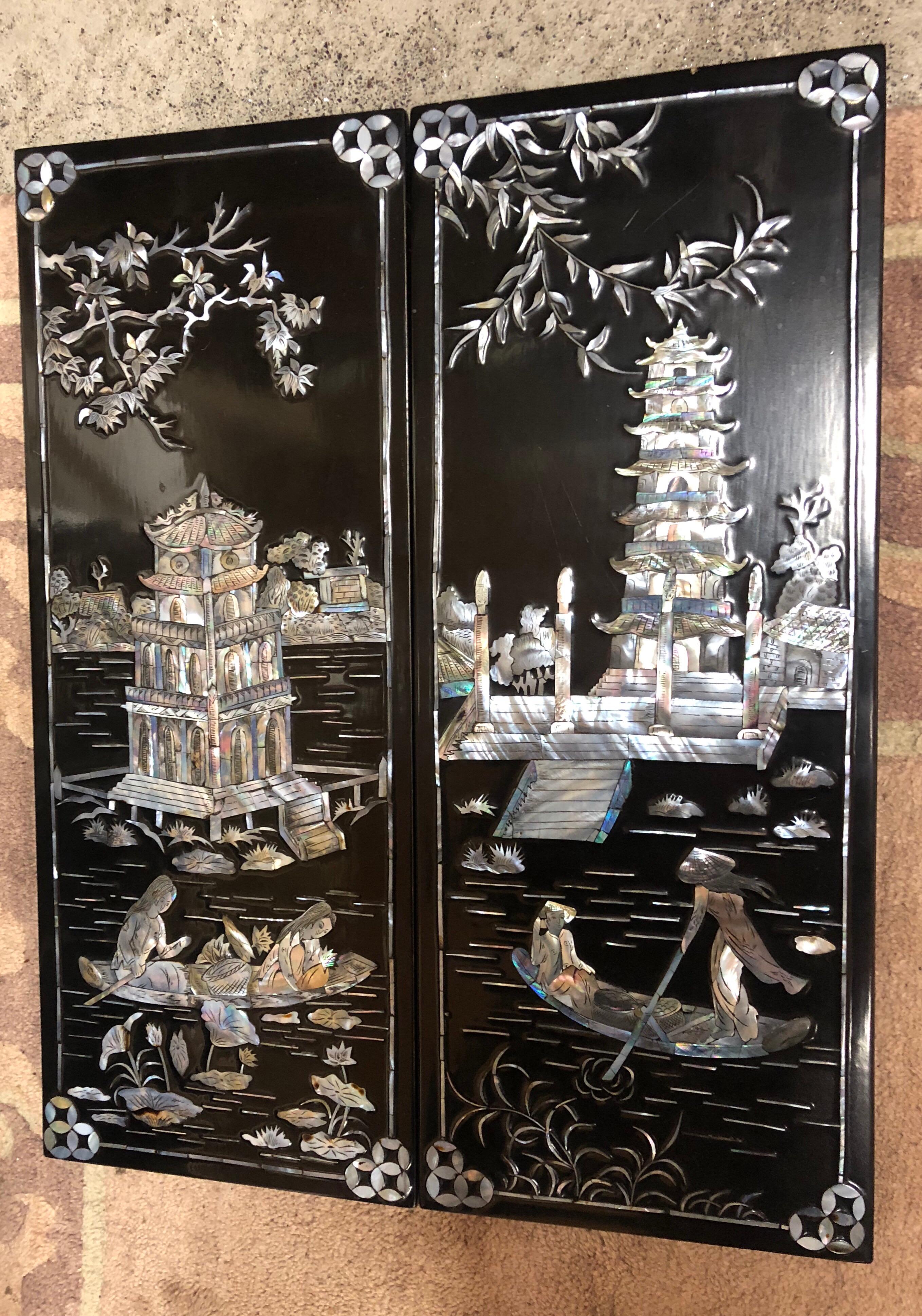 Asian black lacquered mother of pearl small wall panels Chinese geishas.





 