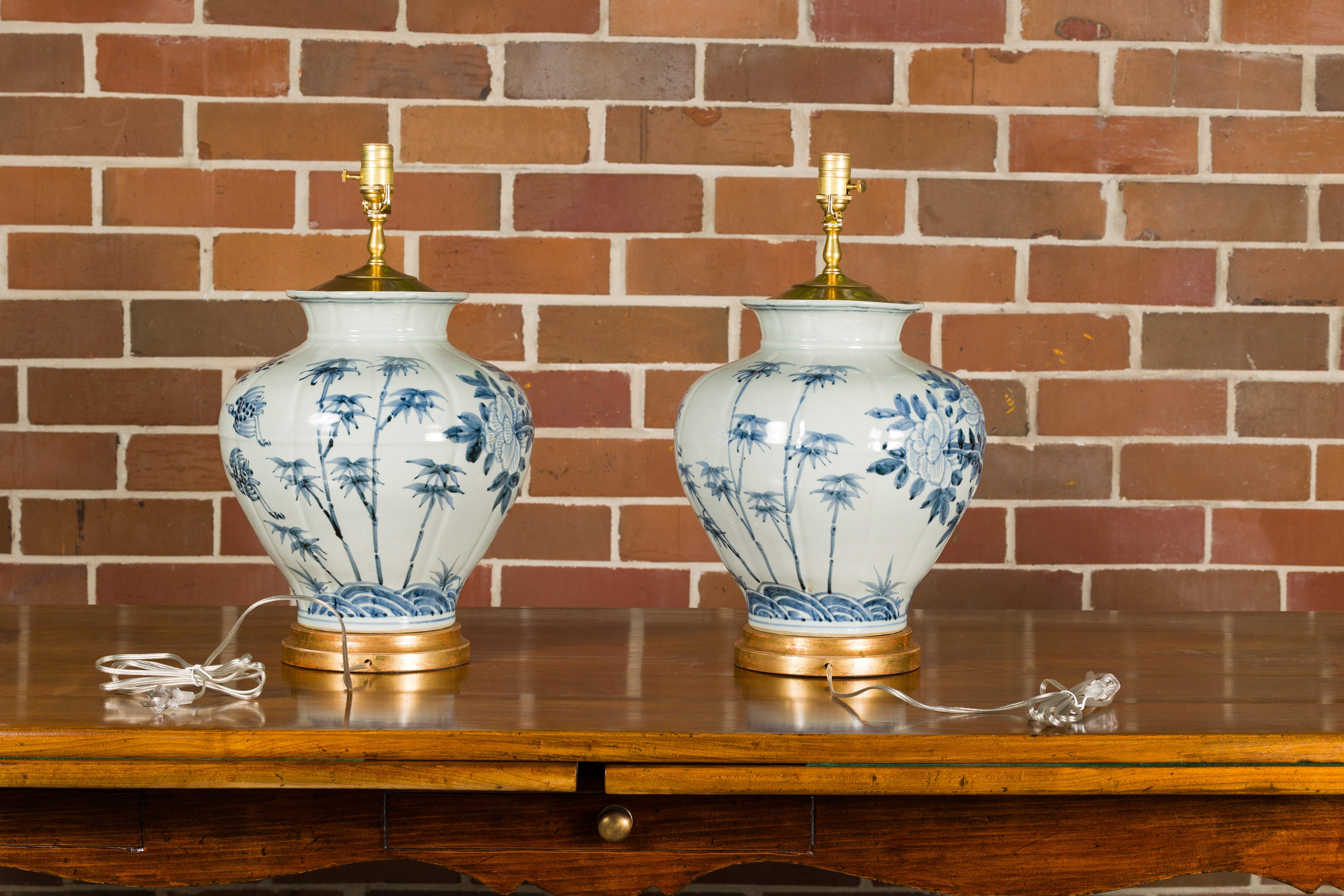 20th Century Asian Blue and White Porcelain Table Lamps with Blooming Trees, a Pair