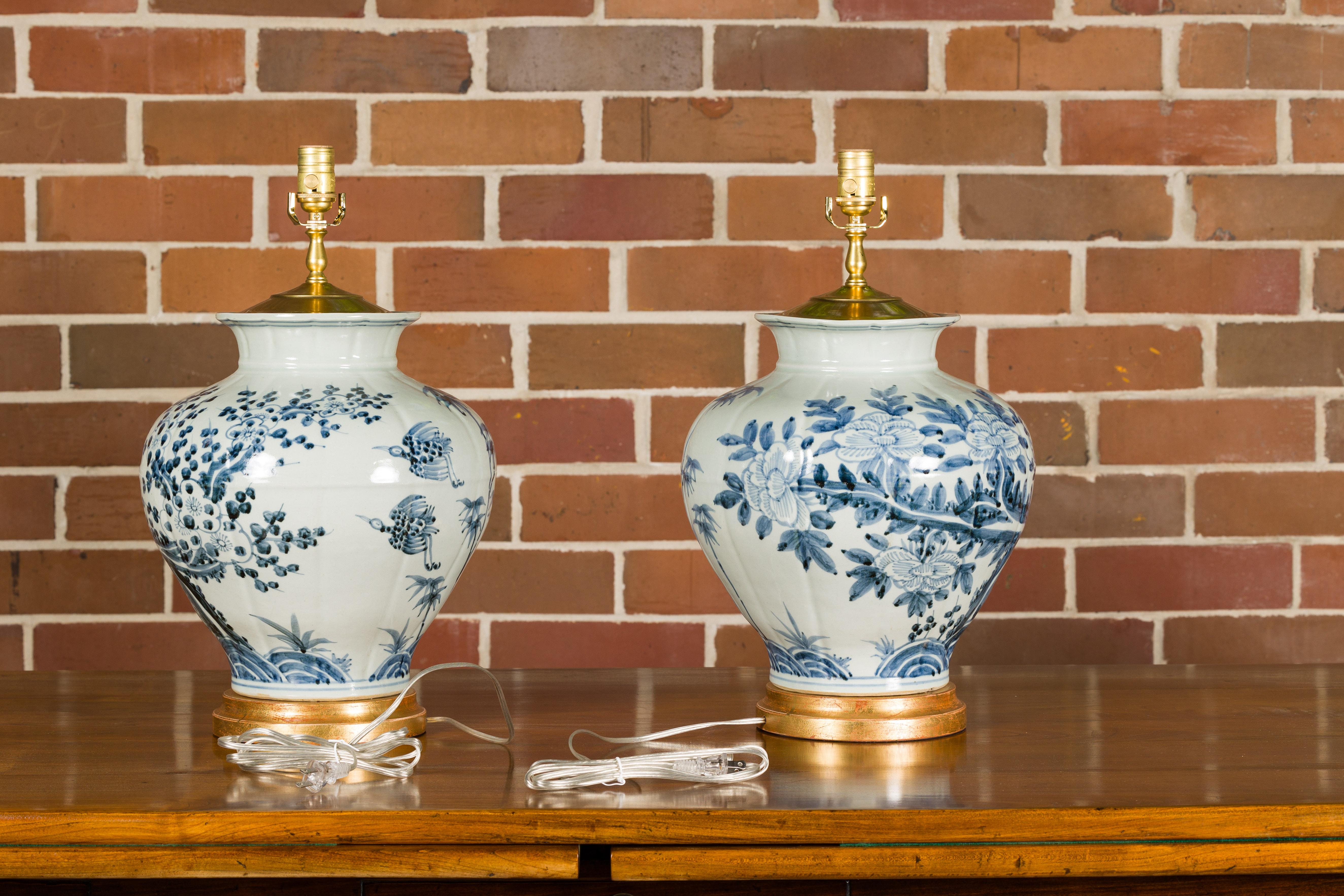 Giltwood Asian Blue and White Porcelain Table Lamps with Blooming Trees, a Pair