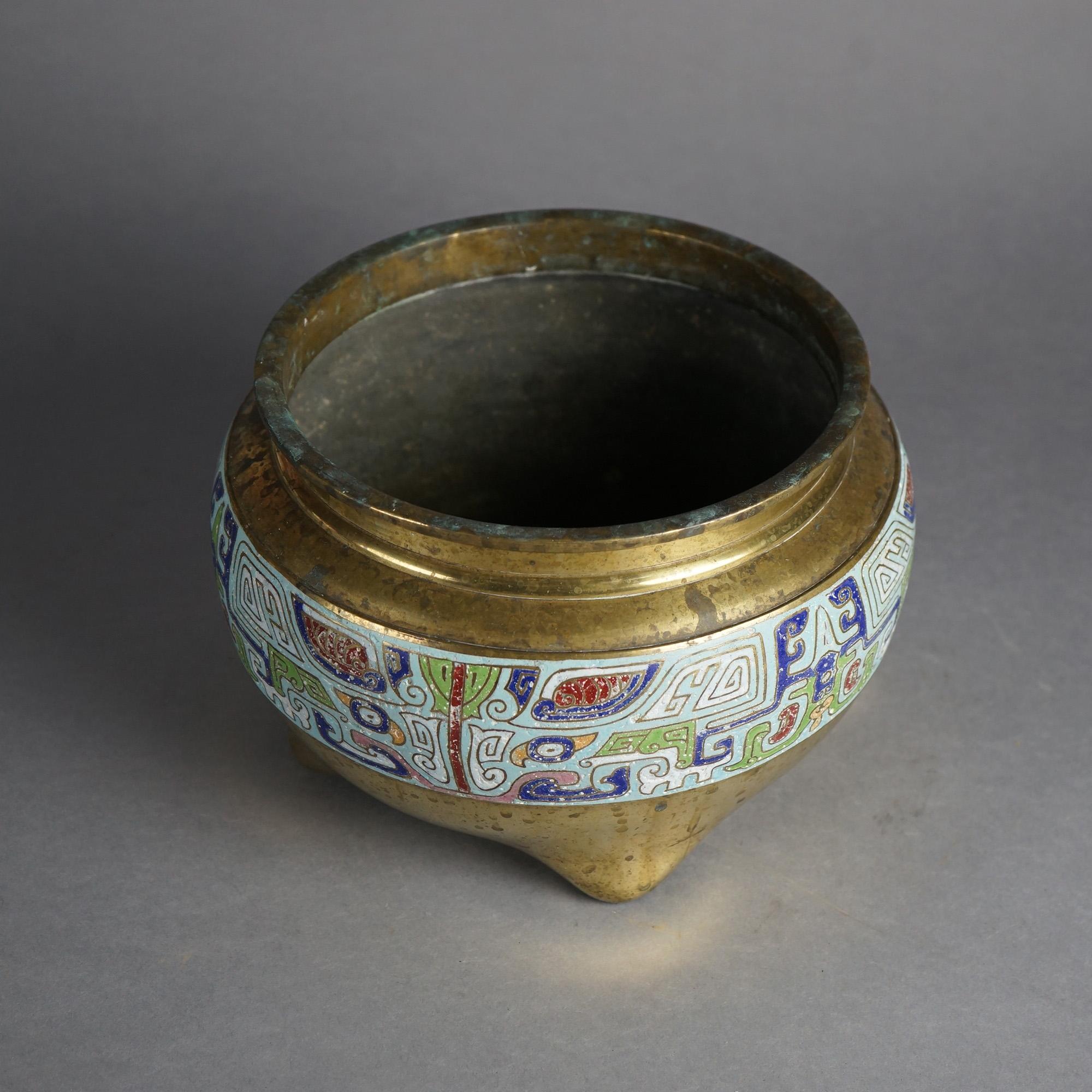 Asian Bronze Footed Jardiniere with Enameled Band with Egyptian Symbols 20thC

Measures- 7.25''H x 10.75''W x 10.75''D