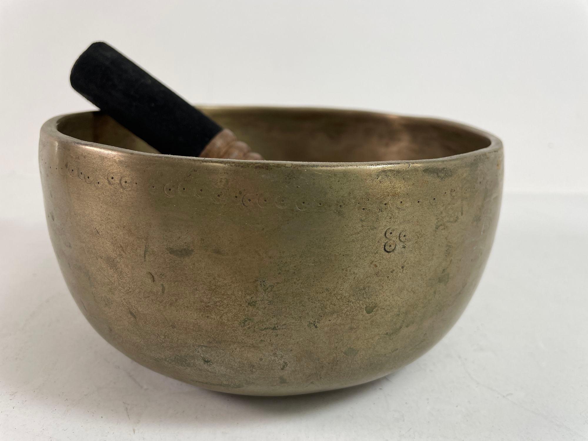 Vintage Asian Hammered Bronze Singing Bowl 1950s.
Asian Bronze Vessel Singing Bowl.
A special collectible piece.
Made from bronze, a good heavy weight.
Circa 1950s.
The hand-hammered Asian bronze bowls are used in some Buddhist religious practices