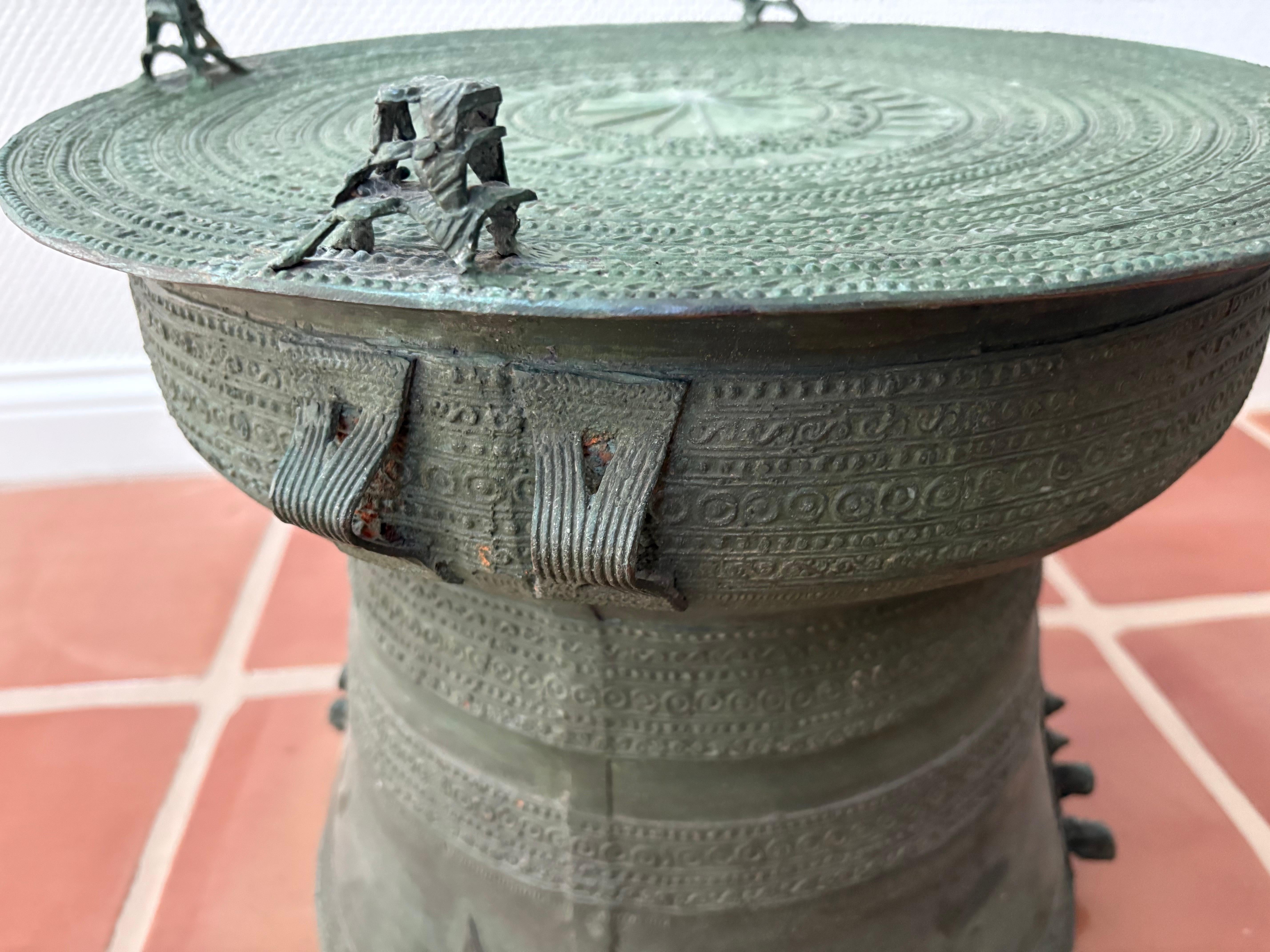 This southeast Asian bronze rain drum is also known as a frog drum is from 20 th century and has wonderful verdigris patina 