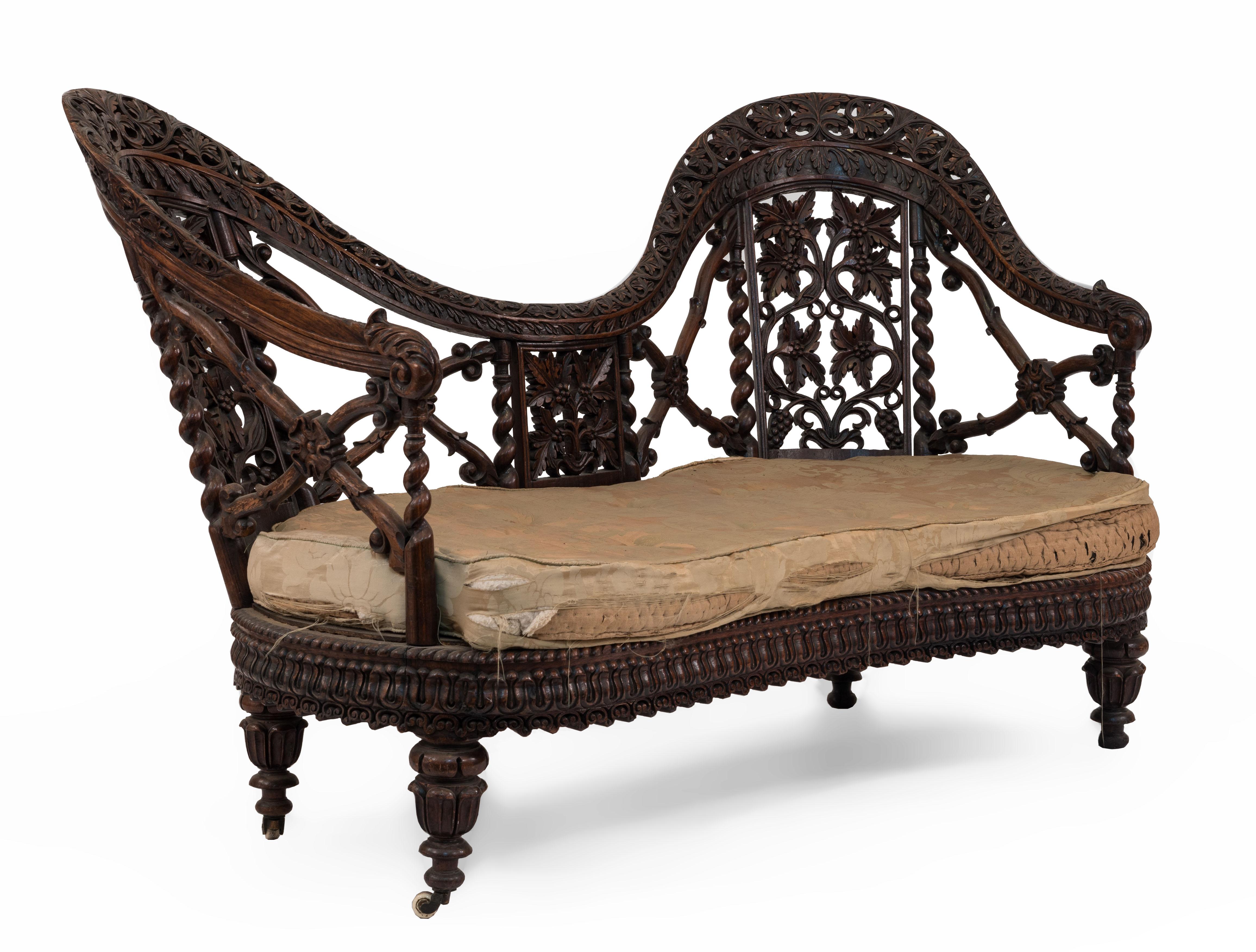 Asian Burmese style (19th Cent) carved filigree rosewood open X design settee with green seat.
