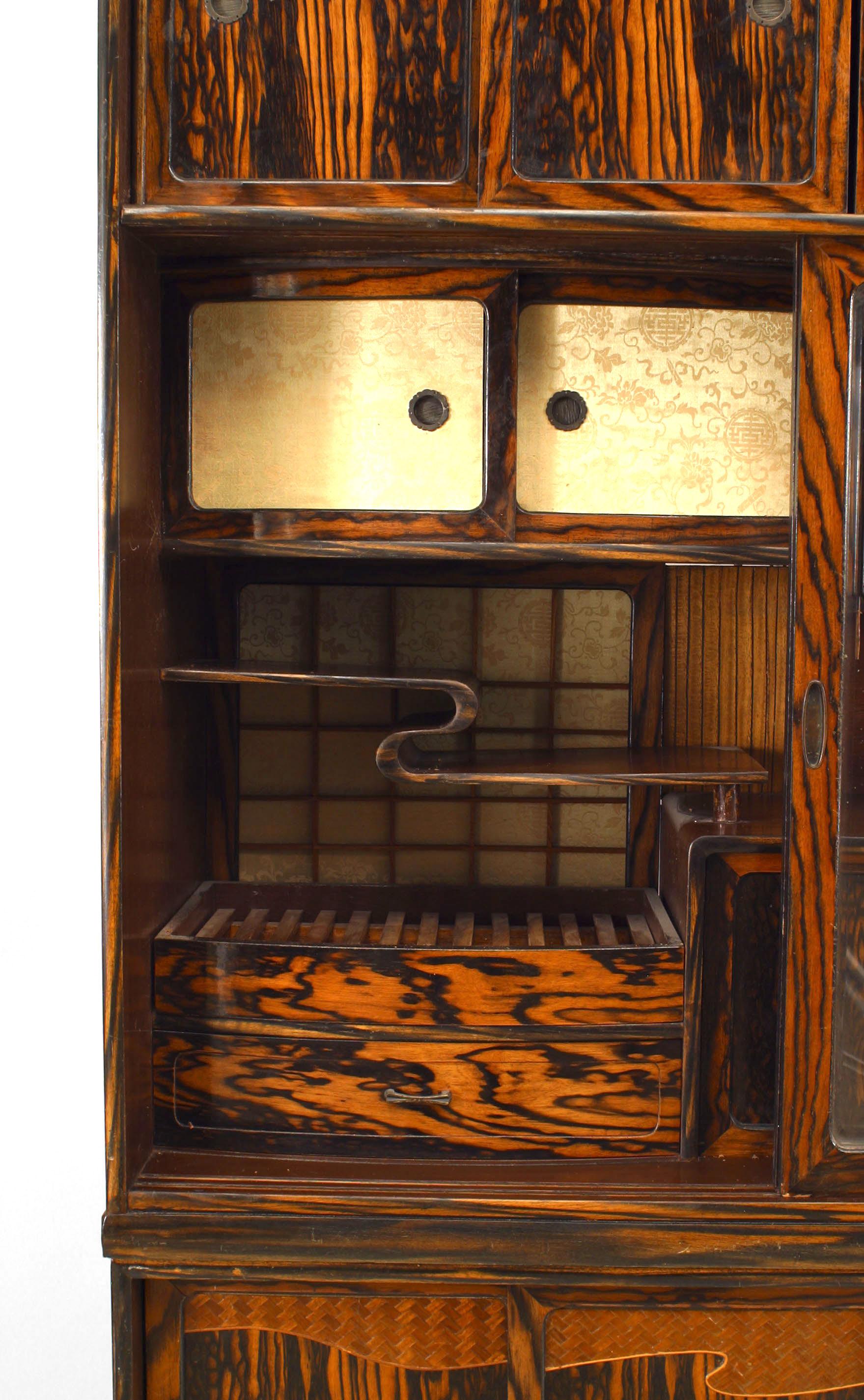 Asian (probably Japanese) section etagere cabinet with 3 pair of wood and a pair of glass sliding doors with 4 drawers & interior sliding doors, shelves & drawers. Keyaki wood on top and sides; persimmon wood on front sliding doors.