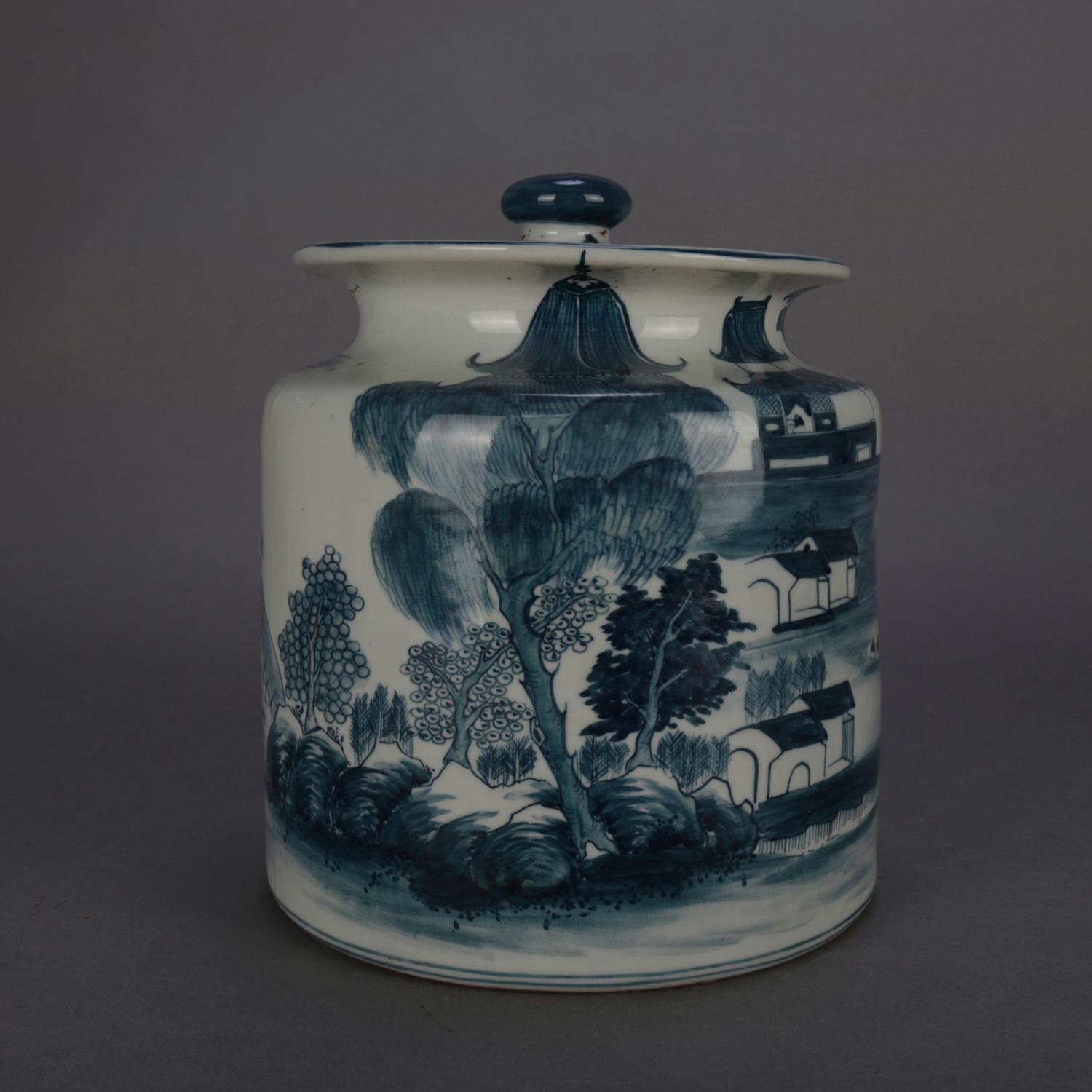 An Asian Canton School pictorial porcelain covered jar features hand painted village scene in blue and white, chop mark signed on base, 20th century

Measures: 10.25