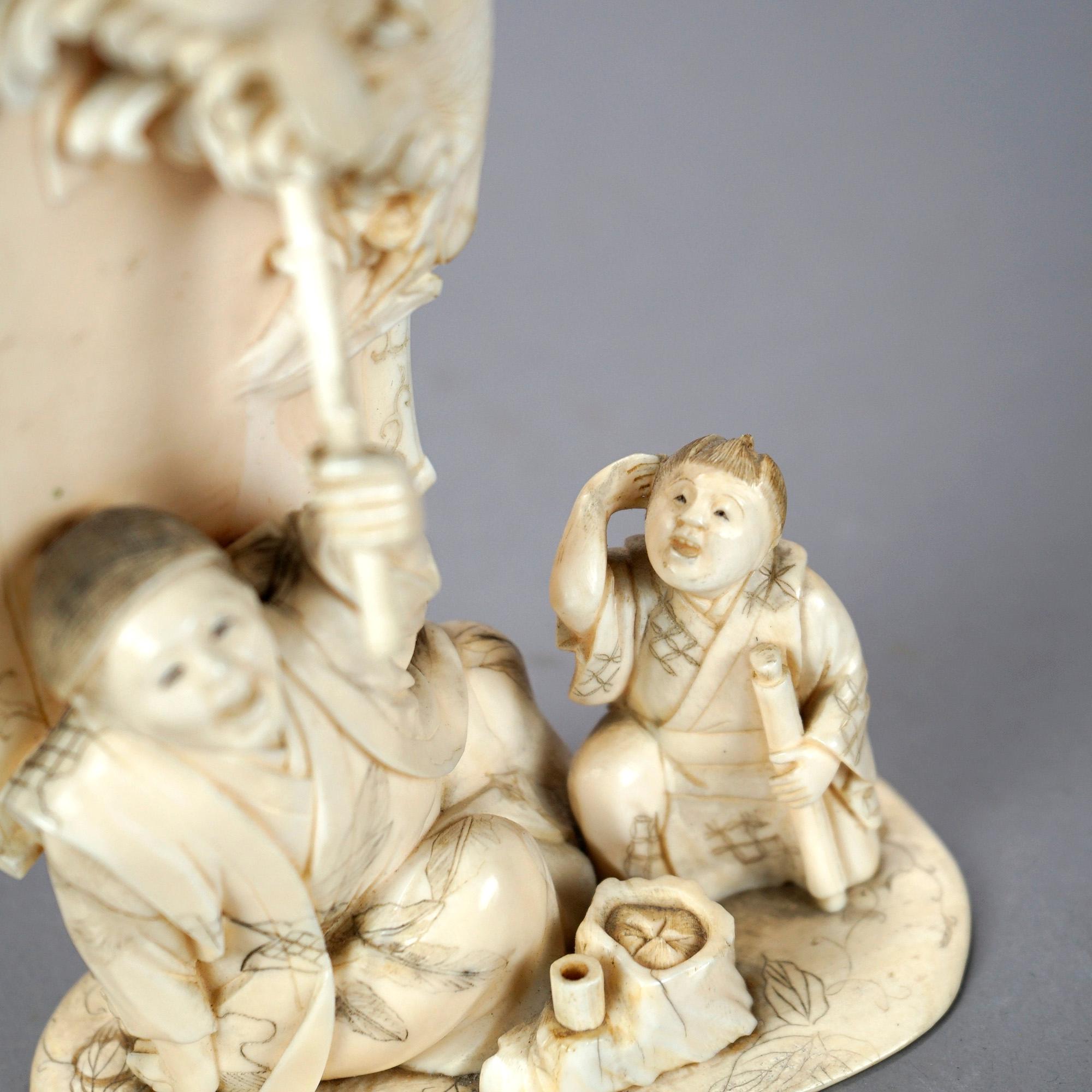 Asian Carved Bone Figure Grouping of Man Telling a Fish Tale, 20th C. 4