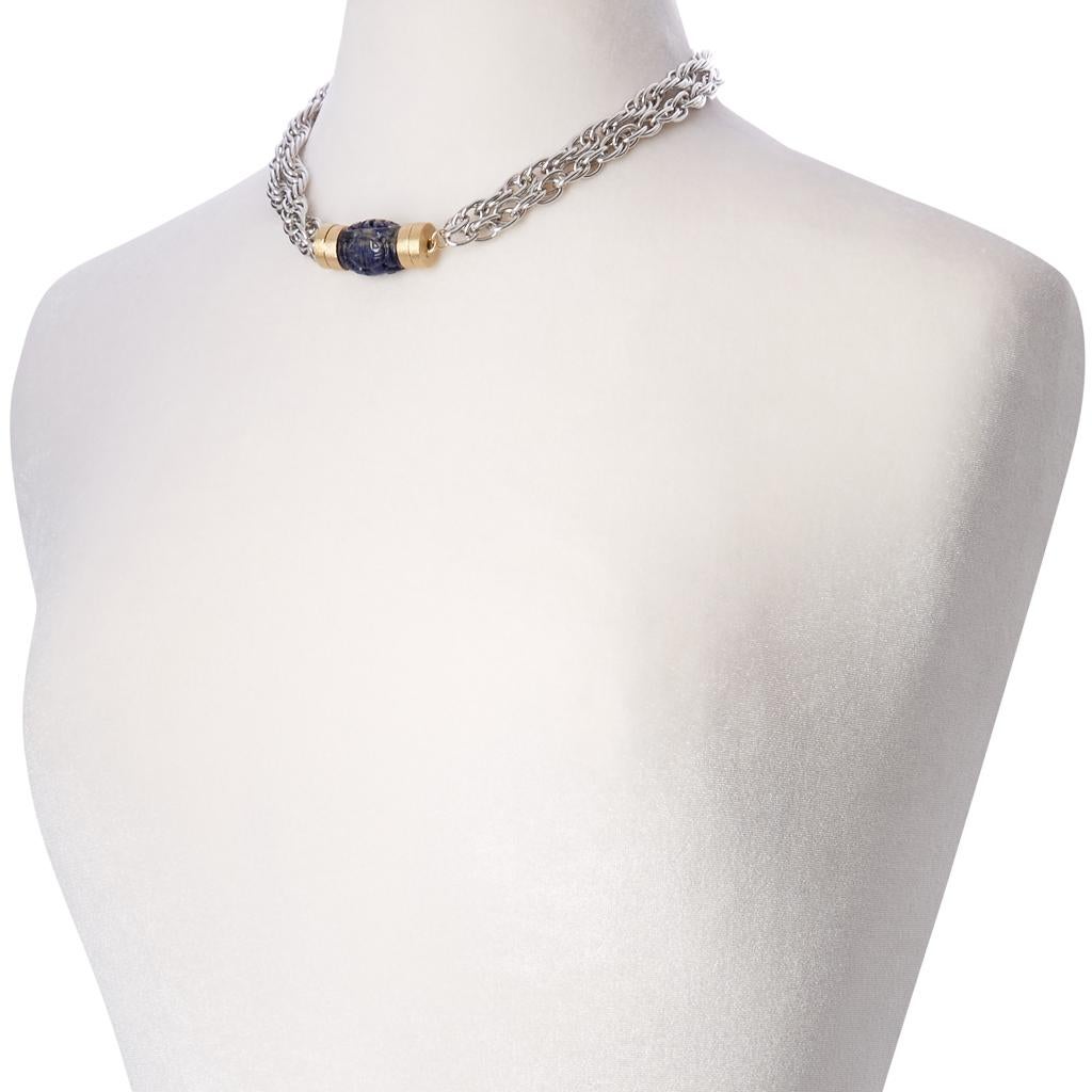 Beautiful sodalite stone with intricate and ornate carvings offering a touch of ancient culture of the East. This piece features our 14K plated yellow gold magnetic studio clasps for a modern yet timeless look.

Create your own perfect look by